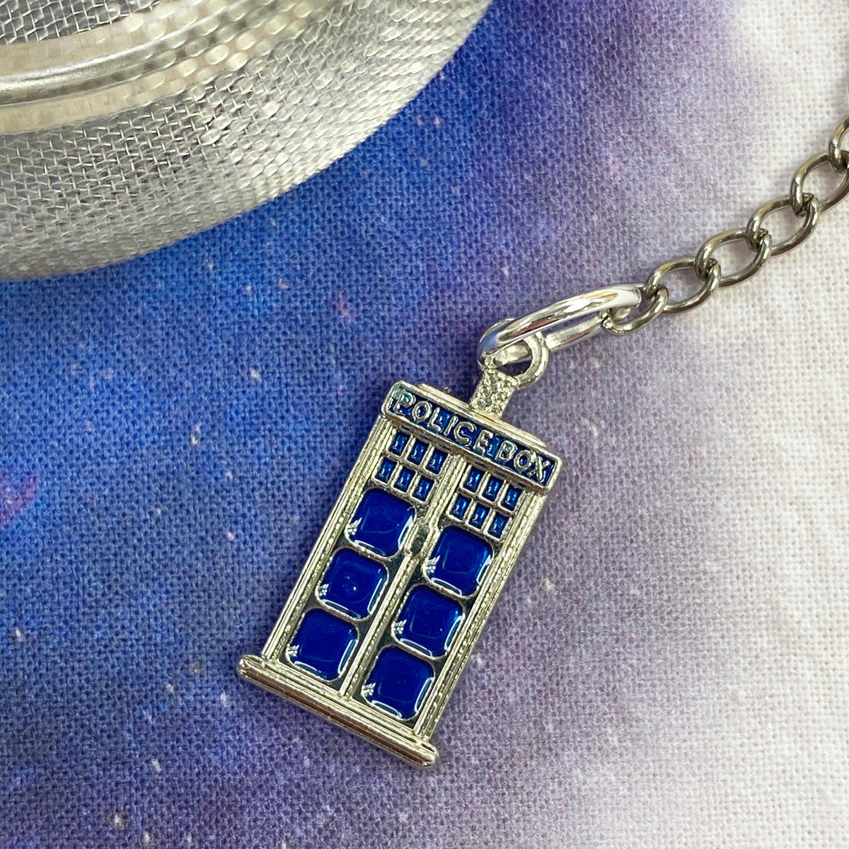 Plum Deluxe Tea Tardis tea infuser ball with detailed Tardis design, perfect for steeping loose leaf tea.