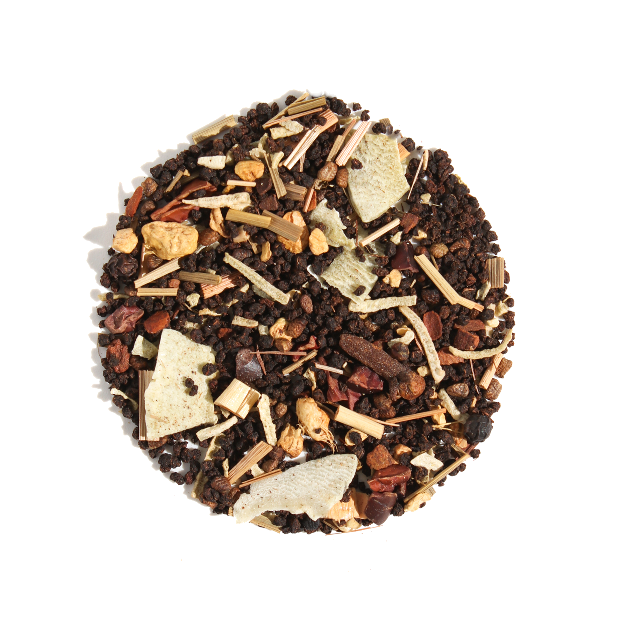 A warm cup of Plum Deluxe Tea's Uplifting Coconut Chai with coconut flakes and chai spices on a cozy wooden table.