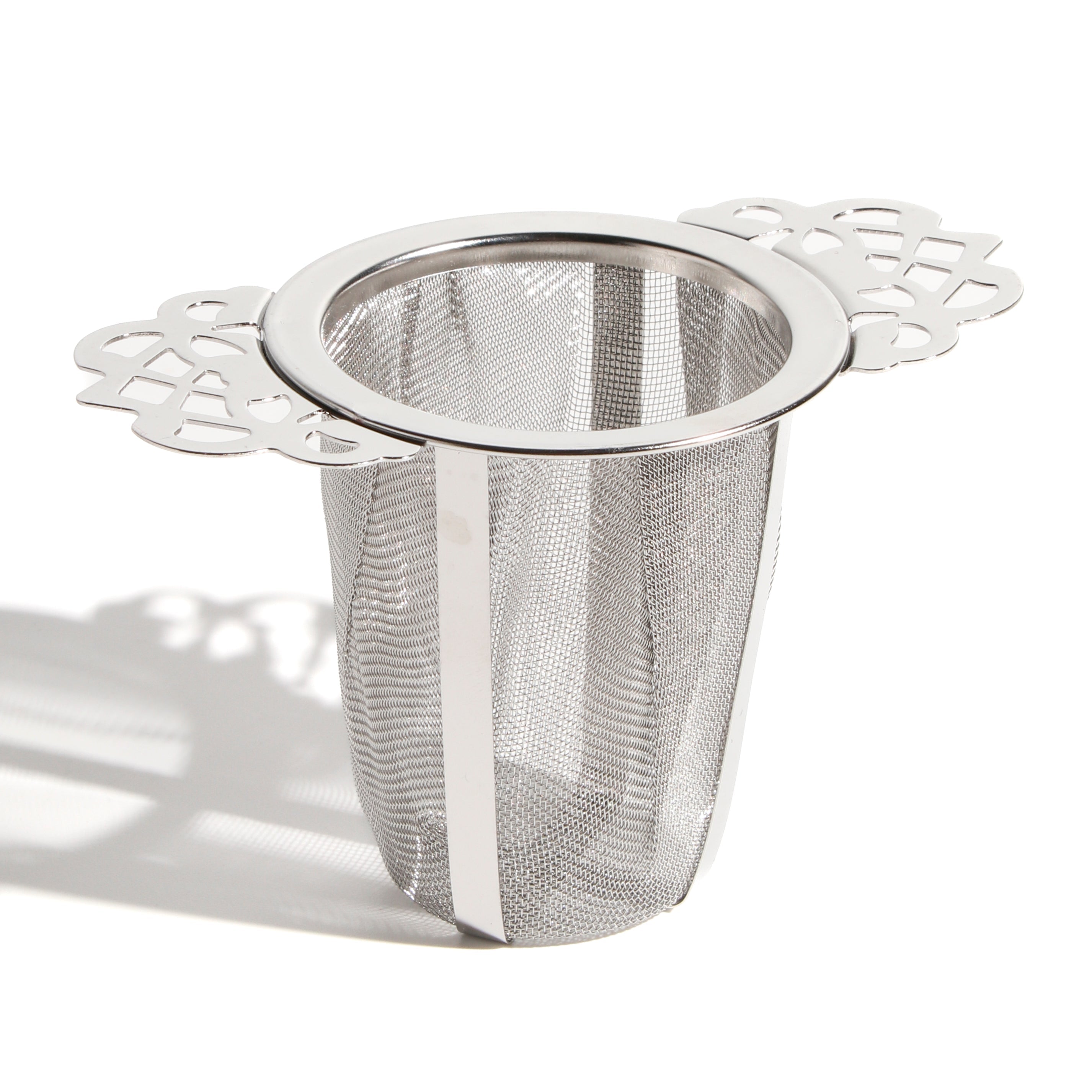 Victorian mesh cone tea infuser labeled "Nest" by Plum Deluxe Tea, with intricate mesh design for steeping loose leaf tea.