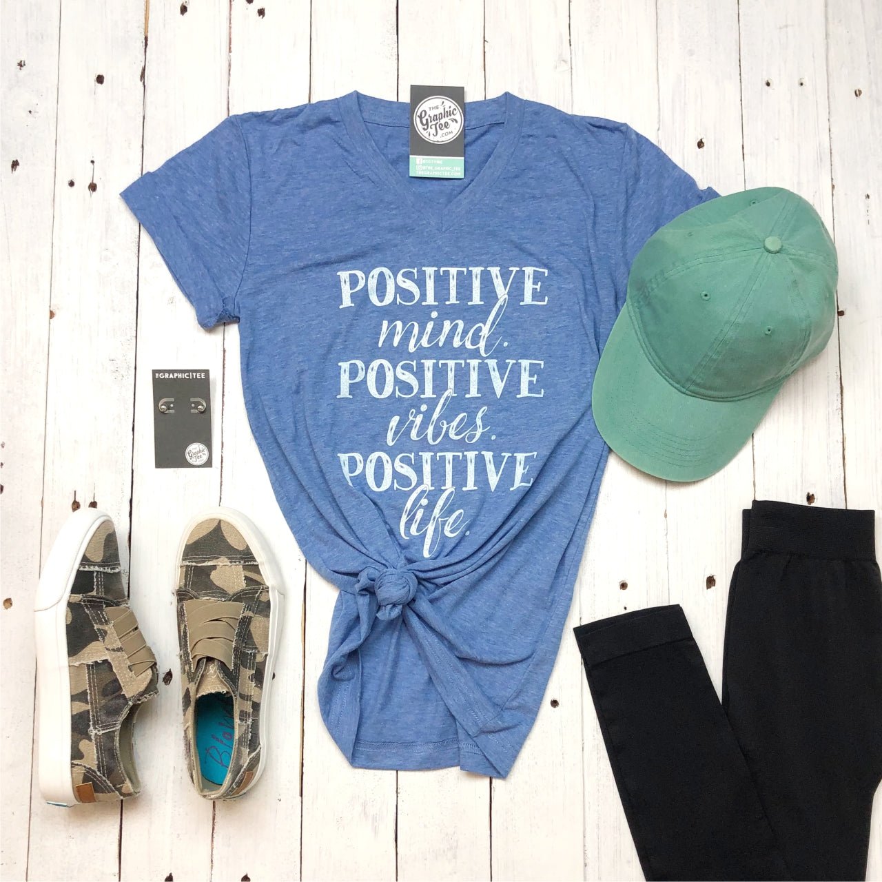 Gray V-neck graphic tee from The Graphic Tee with positive mind, vibes, and life slogan in bold black lettering.