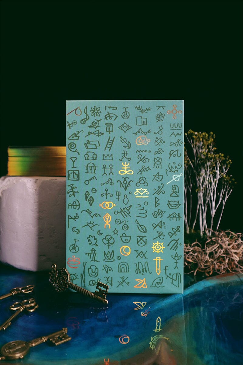 Green Glyphs Tarot deck by Prisma Visions featuring intricate green and black mystical glyph designs on card backs.