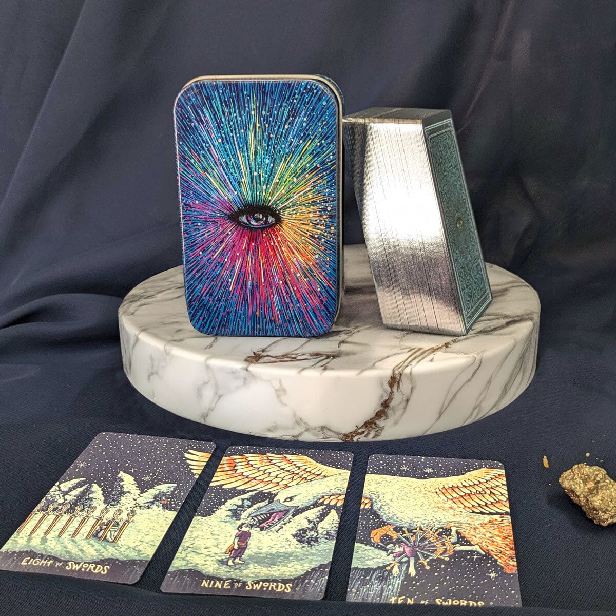 Little Prisma Visions deck by Prisma Visions featuring vibrant, colorful tarot card designs laid out on a table.