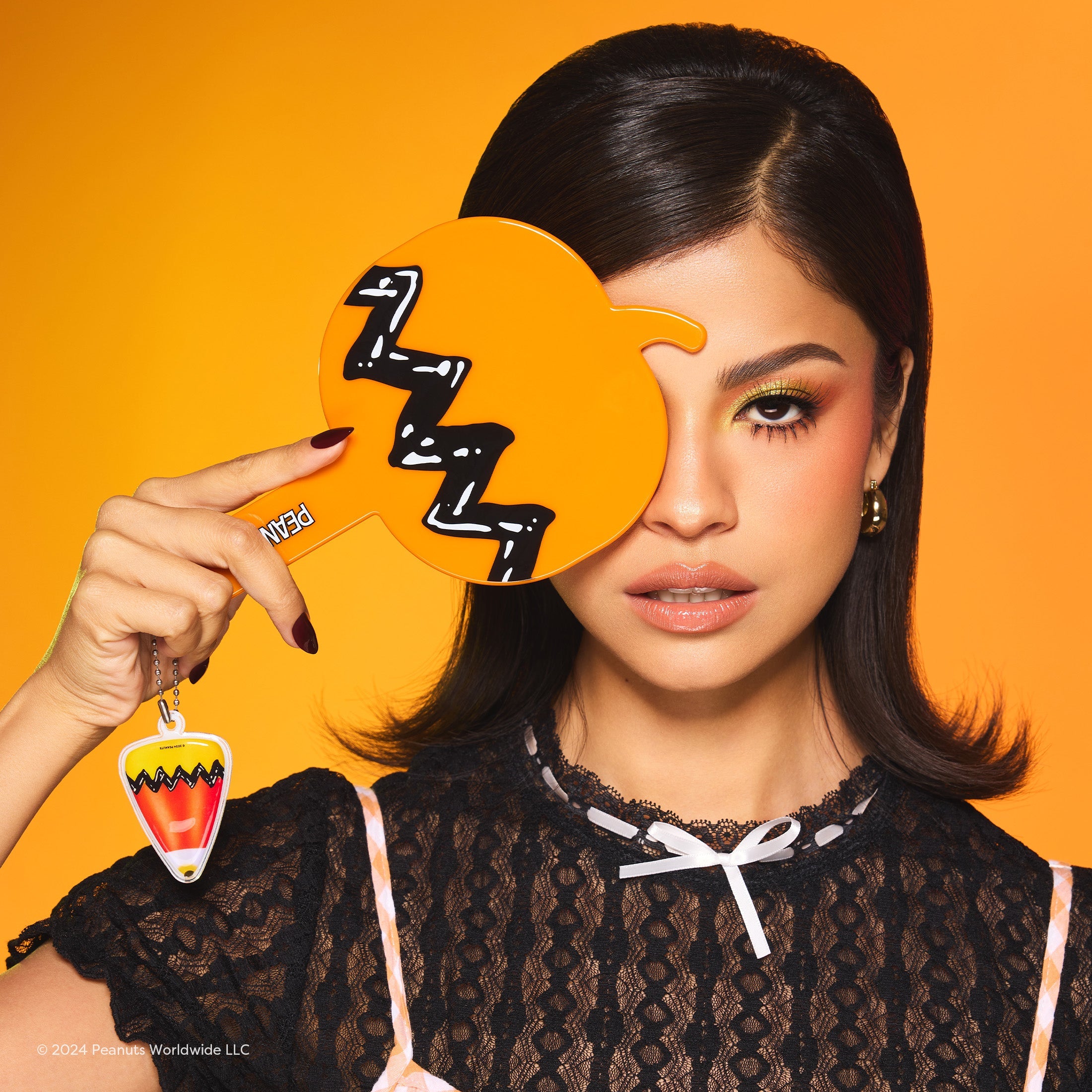 Peanuts Halloween Hello Great Pumpkin handheld mirror by Profusion Cosmetics featuring festive pumpkin design accessory.
