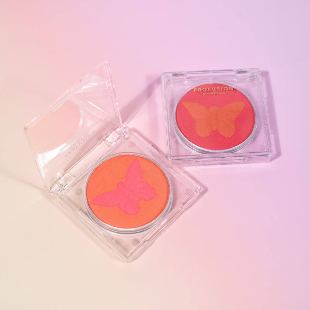 Profusion Cosmetics Empowered Butterfly Social Butterfly Mousse Blush with butterfly design on peach-toned powder.