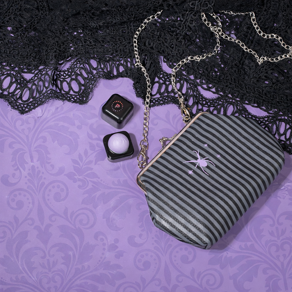 Profusion Cosmetics Gothic Beauty cosmetic bag with eye makeup and lip balm set, featuring dark, stylish design and multiple eye products.
