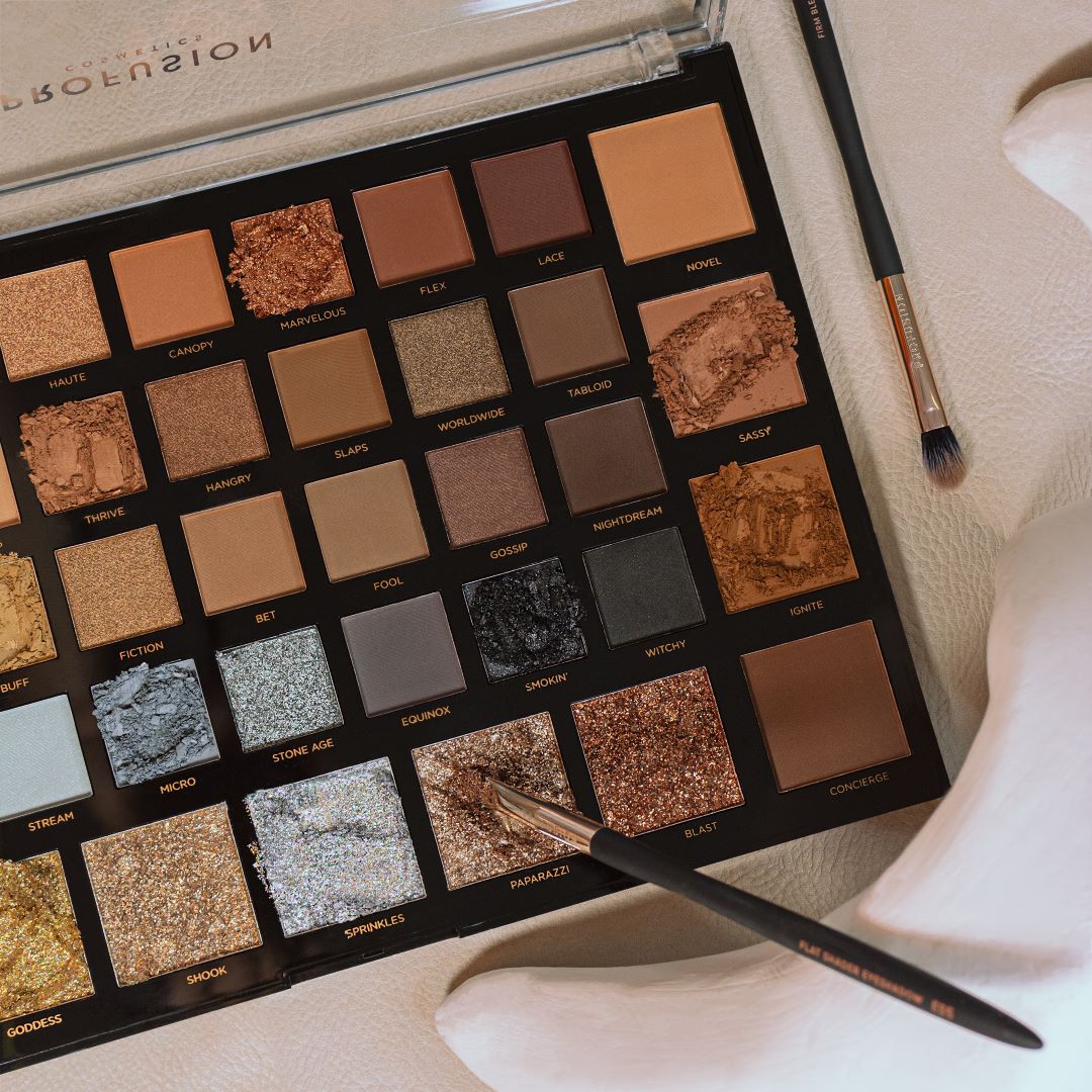 Profusion Cosmetics Moonstone eye shadow with shimmering beige and light brown tones, shown on a neutral background.