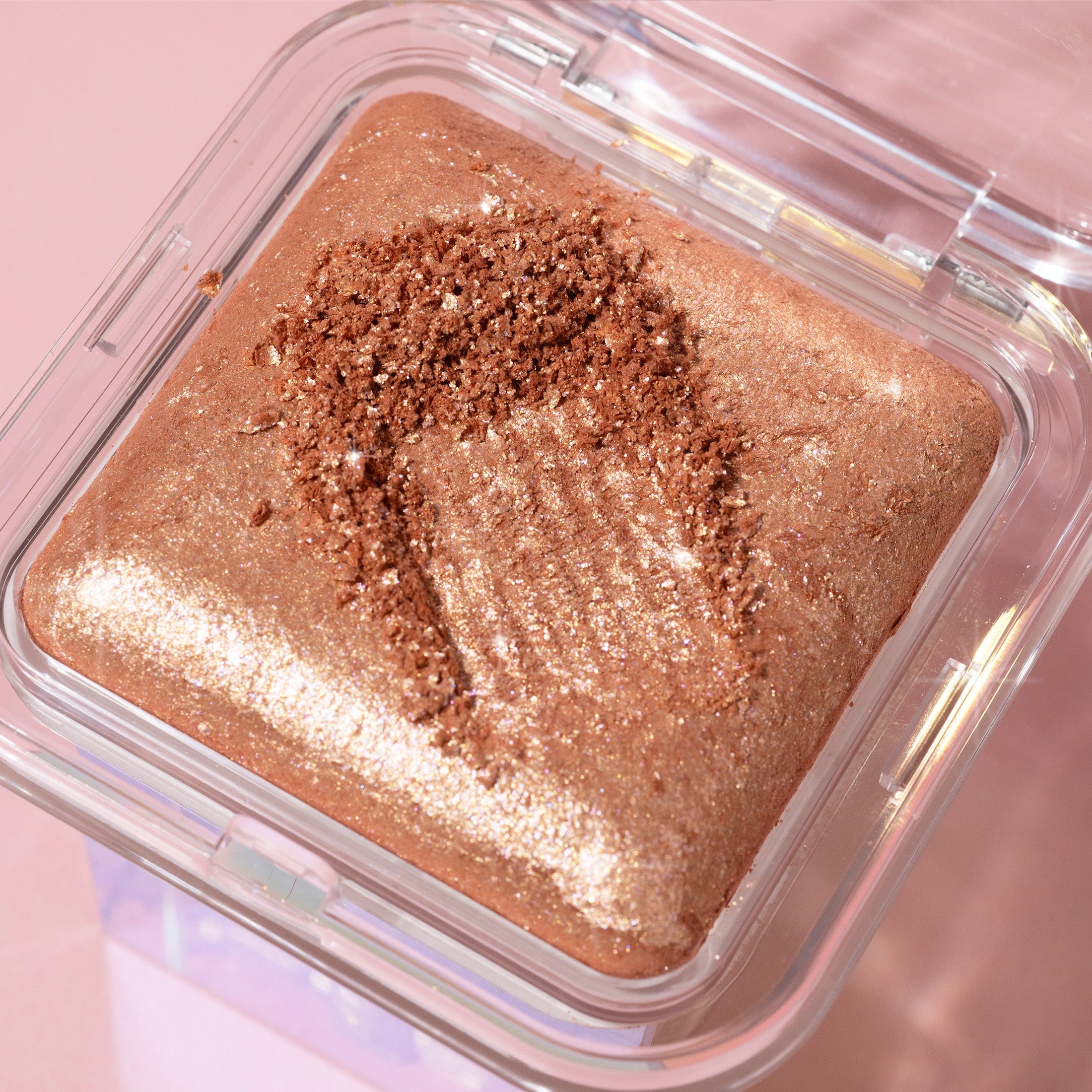 Profusion Cosmetics Holo Beam holographic face highlighter with a luminous, iridescent glow on the skin.