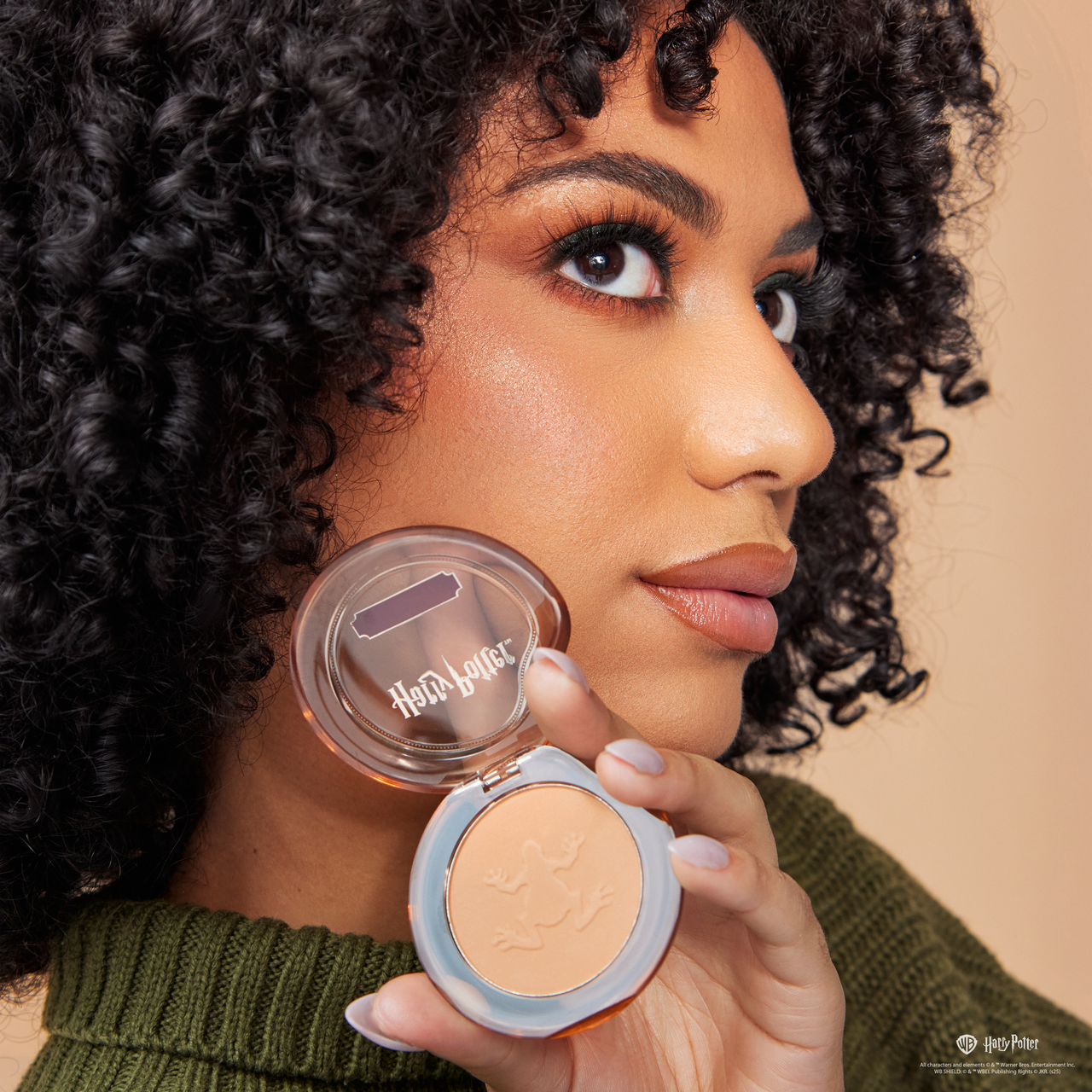 Profusion Cosmetics Harry Potter Holiday Chocolate Frog bronzer powder for face, featuring Harry Potter-themed packaging and design.