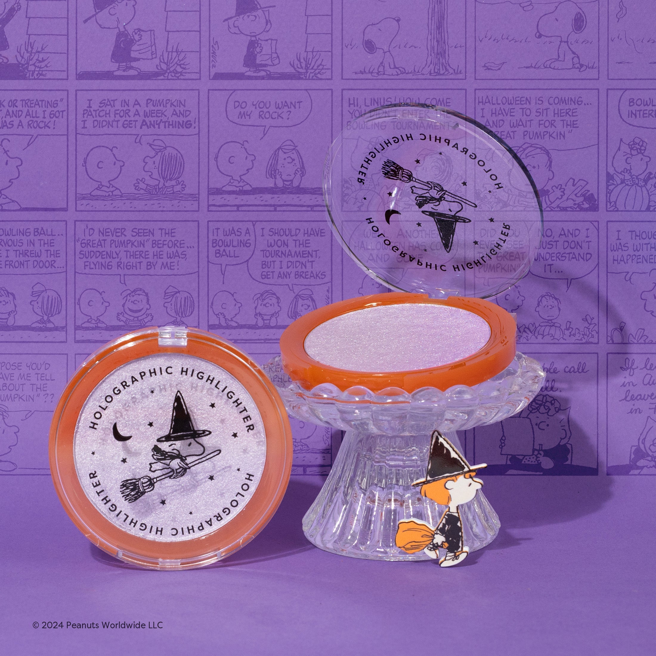 Profusion Cosmetics Peanuts Halloween Spooktacular Glow holographic face highlighter with a shimmering, colorful finish.