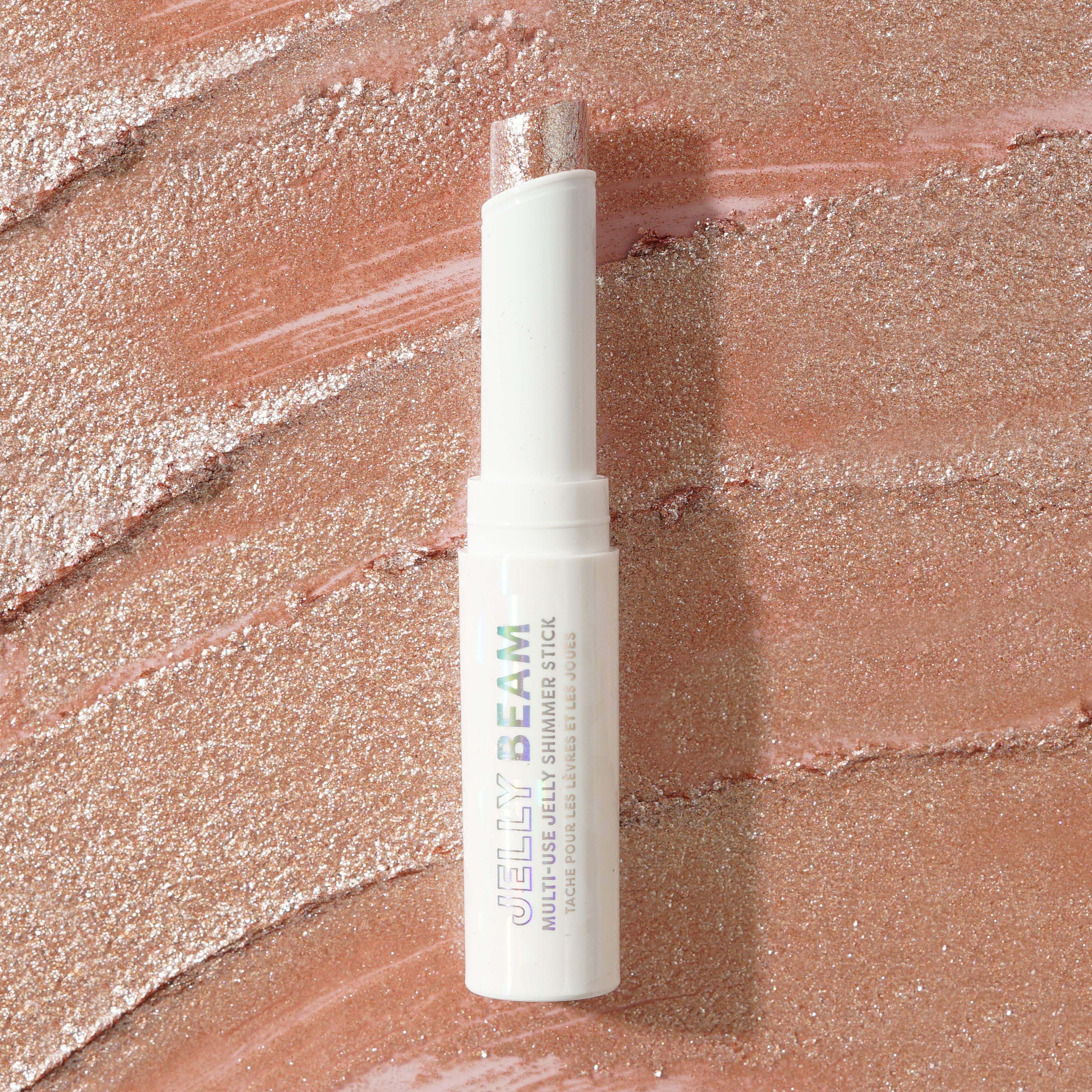 Profusion Cosmetics Jelly Beam Jelly Shimmer Stick for face, with a smooth, luminous pink glow and shimmering finish.