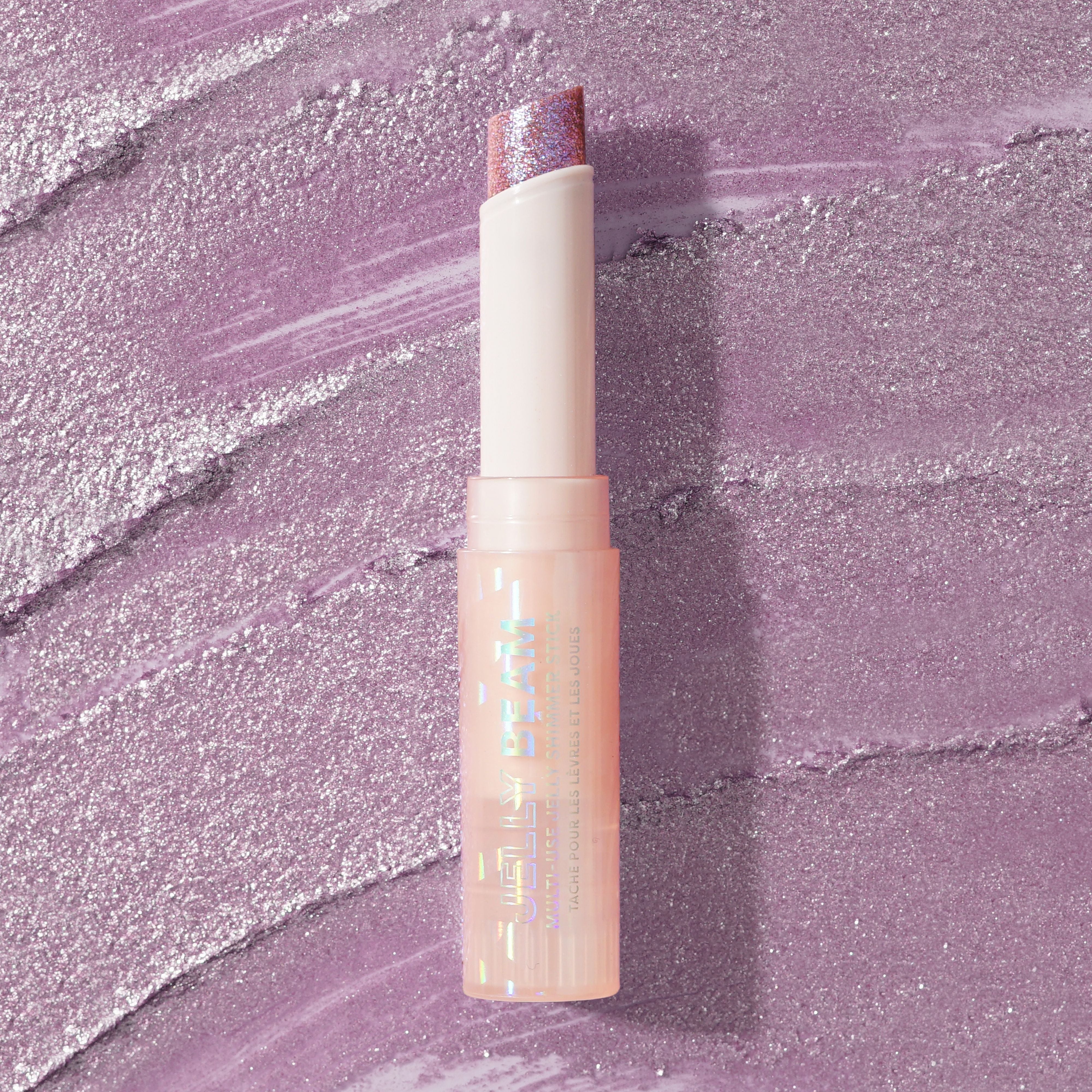 Profusion Cosmetics Jelly Beam Jelly Shimmer Stick for face, showcasing a luminous, shimmering makeup product.