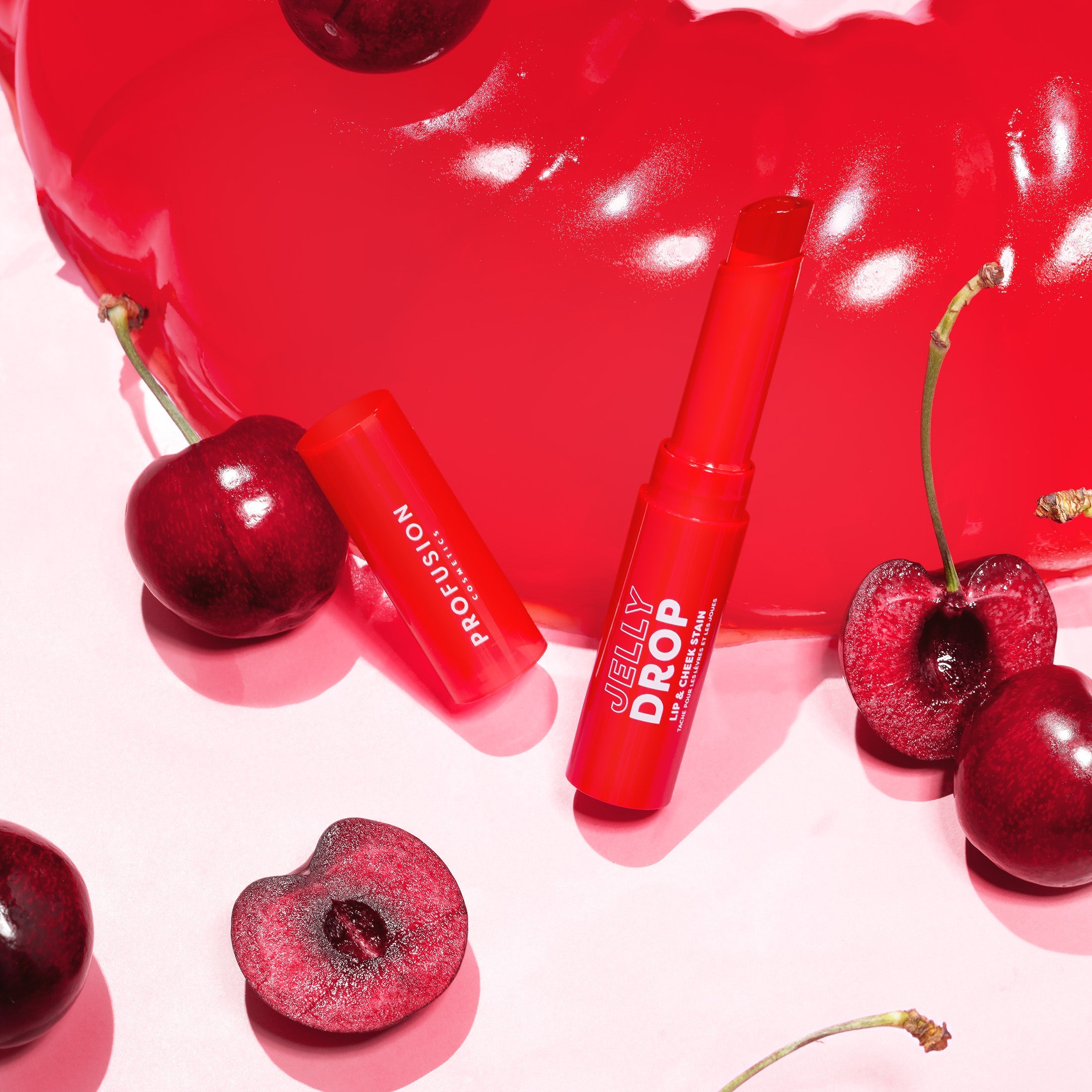 Profusion Cosmetics Jelly Drop Lip and Cheek Stain in Coral Crush, showcasing a vibrant, glossy lip and cheek color.