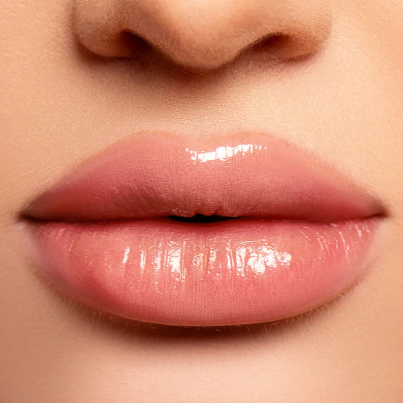 Profusion Cosmetics Hydrating Liquid Lip Gloss applied on lips, featuring a glossy, smooth finish in a natural shade.