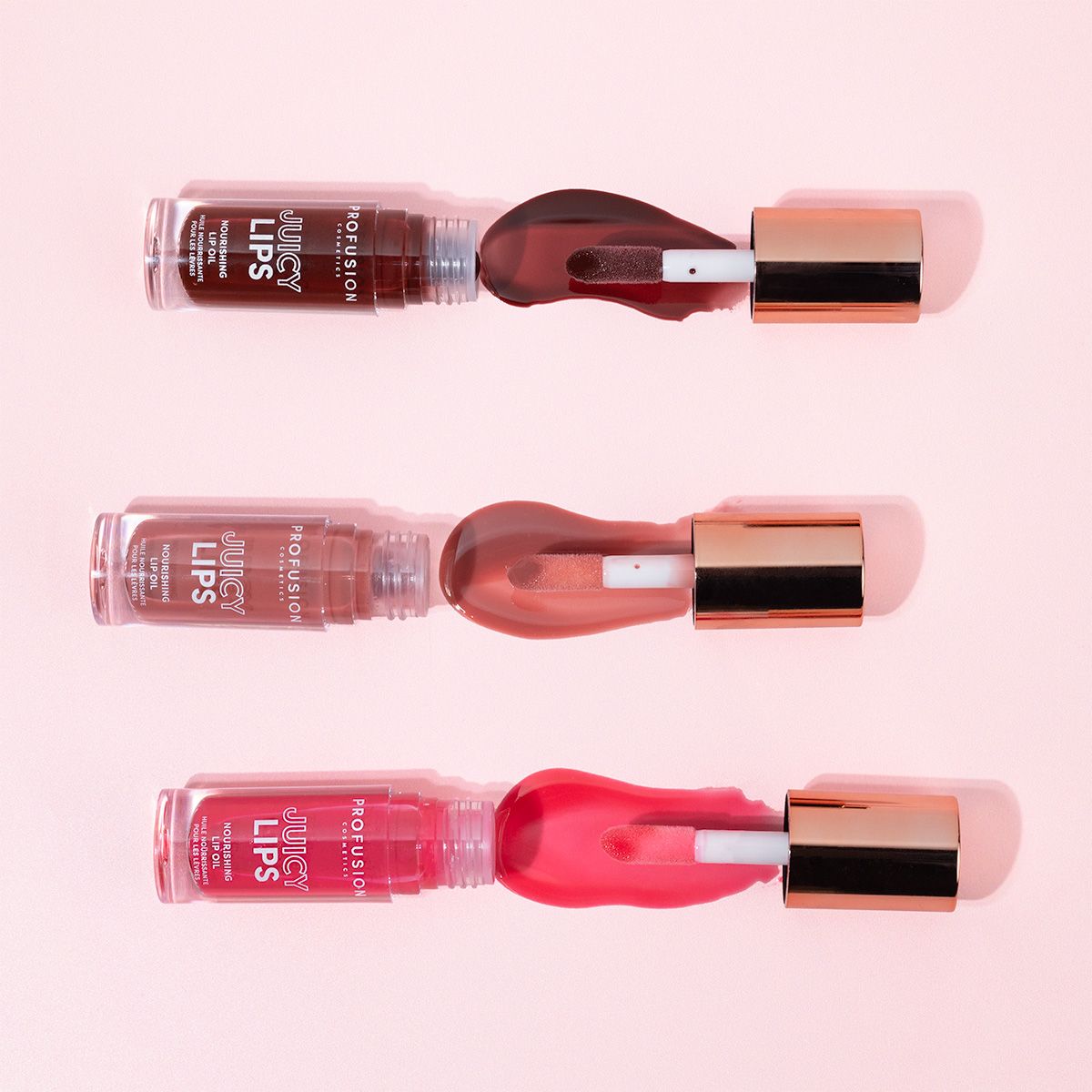 Profusion Cosmetics Juicy Lips in Radiant Rose, close-up of glossy pink lip product with smooth finish.