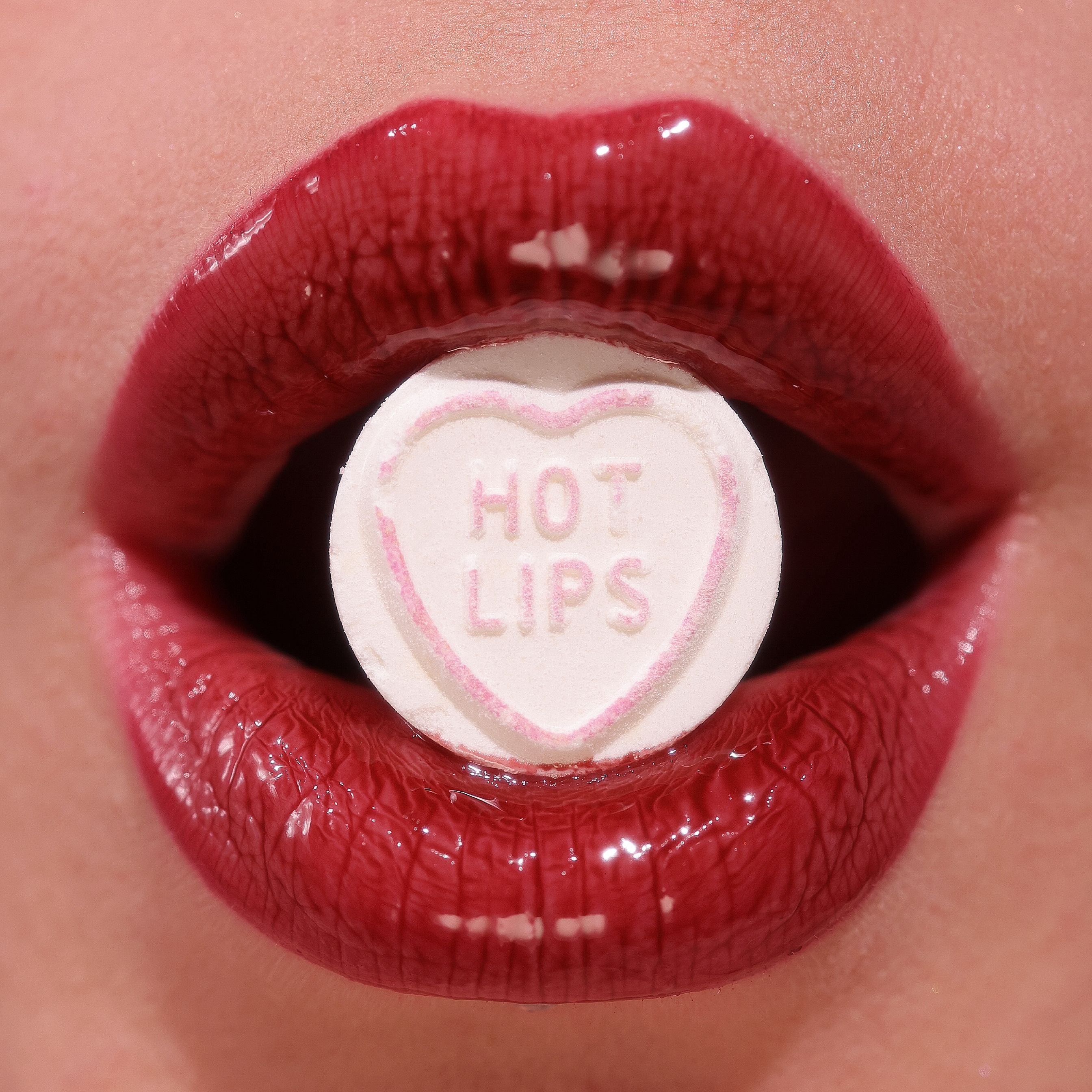 Profusion Cosmetics Juicy Lips with radiant rose shade, close-up of glossy lips with smooth texture and vibrant color.