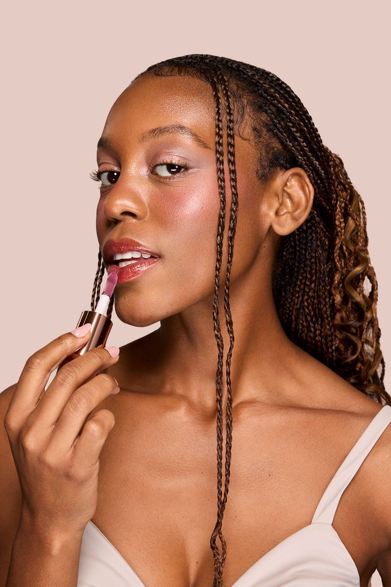 Profusion Cosmetics Juicy Lips in Radiant Rose, showing vibrant pink lip gloss with a glossy finish.