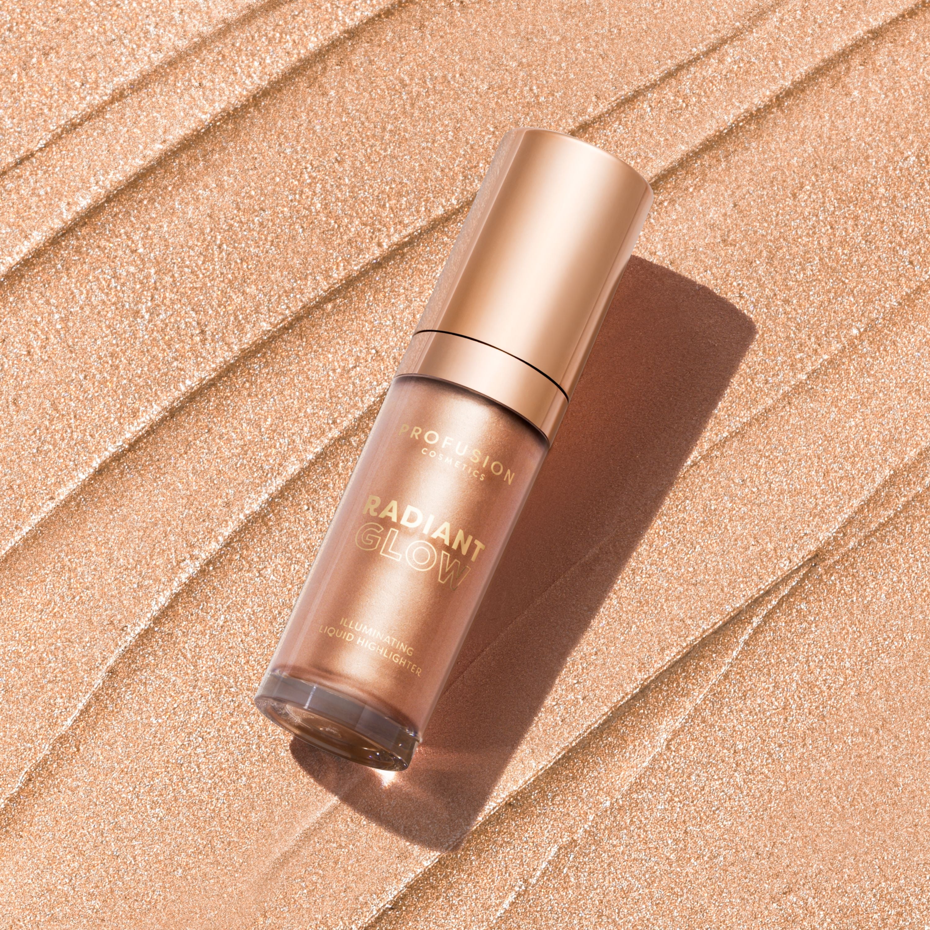 Profusion Cosmetics Radiant Glow Illuminating Liquid Highlighter in champagne shade, showcasing its smooth, shimmering liquid texture.