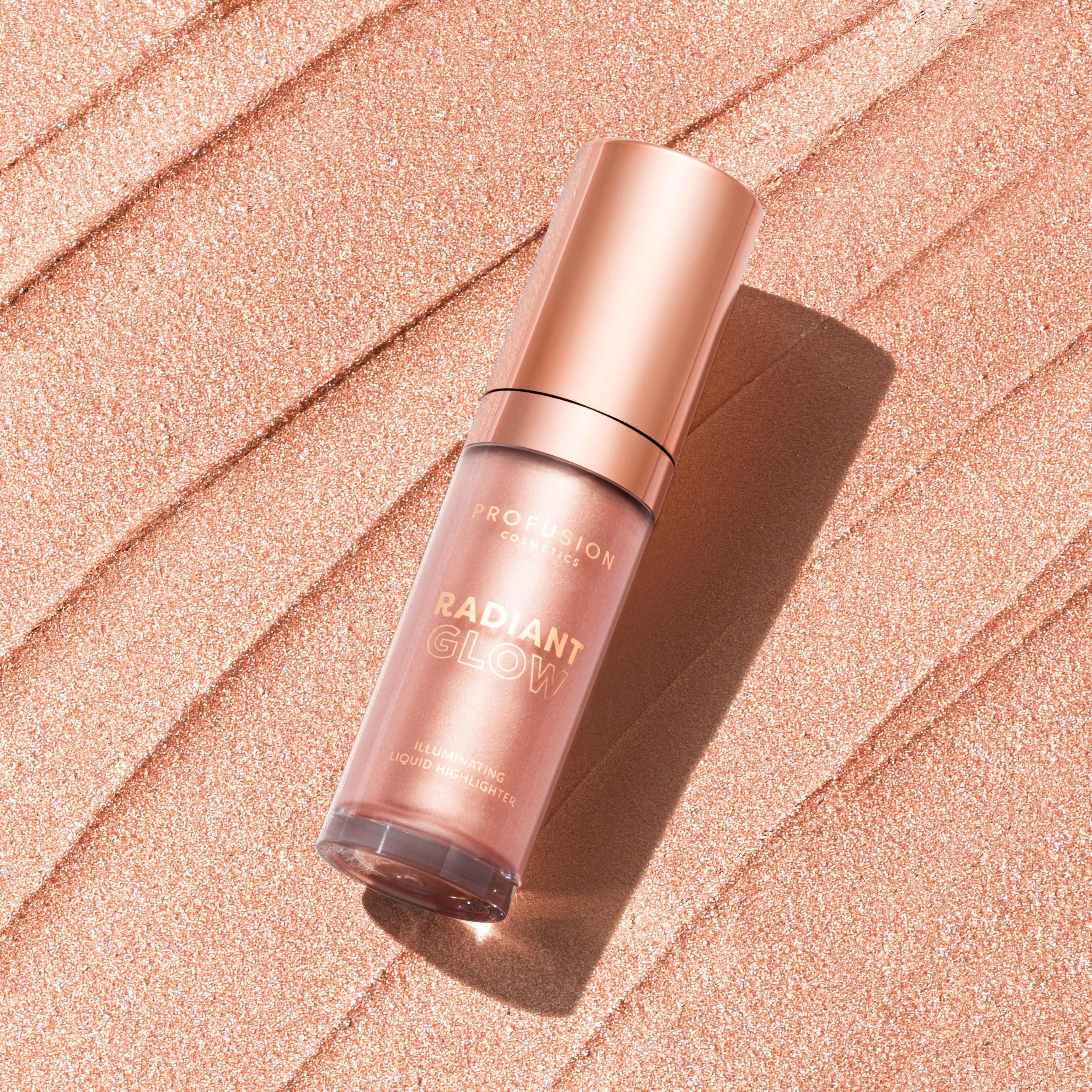Profusion Cosmetics Radiant Glow illuminating liquid highlighter in champagne shade, showcasing a sleek tube with a glowing finish.