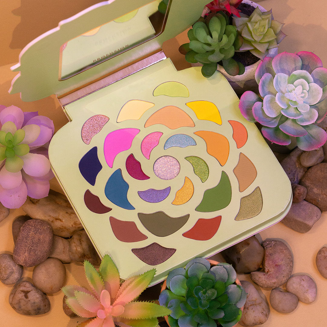 Profusion Cosmetics Desert Sage 25-Shade Makeup Palette with brushes, featuring vibrant eyeshadow colors and applicator tools.