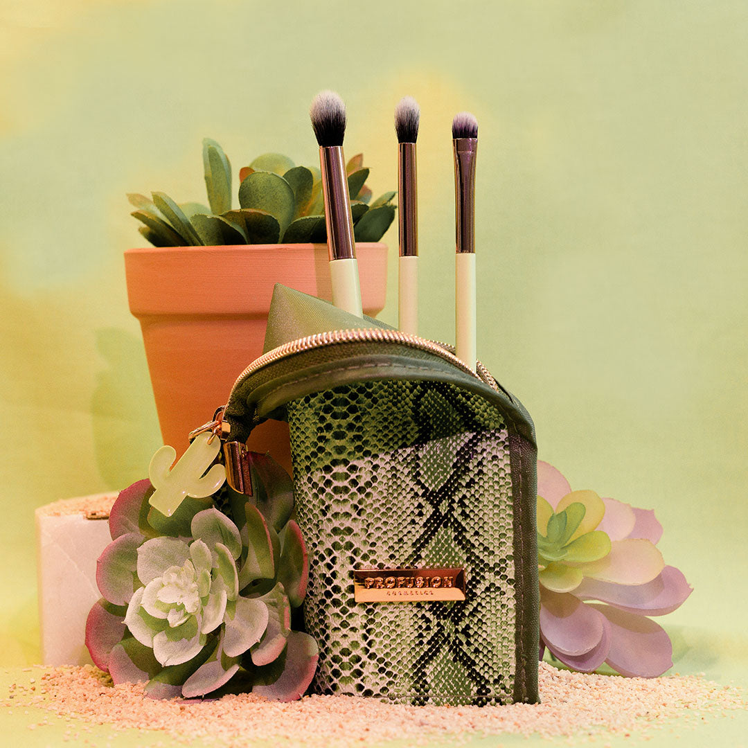 Profusion Cosmetics Desert Sage makeup brush set with 4 brushes, bag, and stand, featuring natural-toned bristles and sleek design.