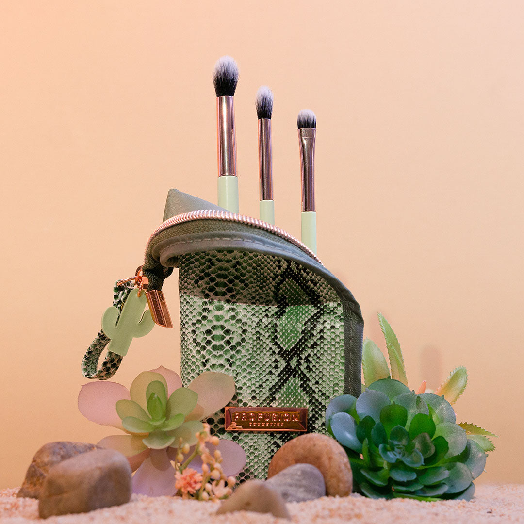 Profusion Cosmetics Desert Sage makeup brush set with 4 brushes, stand, and bag, featuring natural-colored bristles and sleek design.