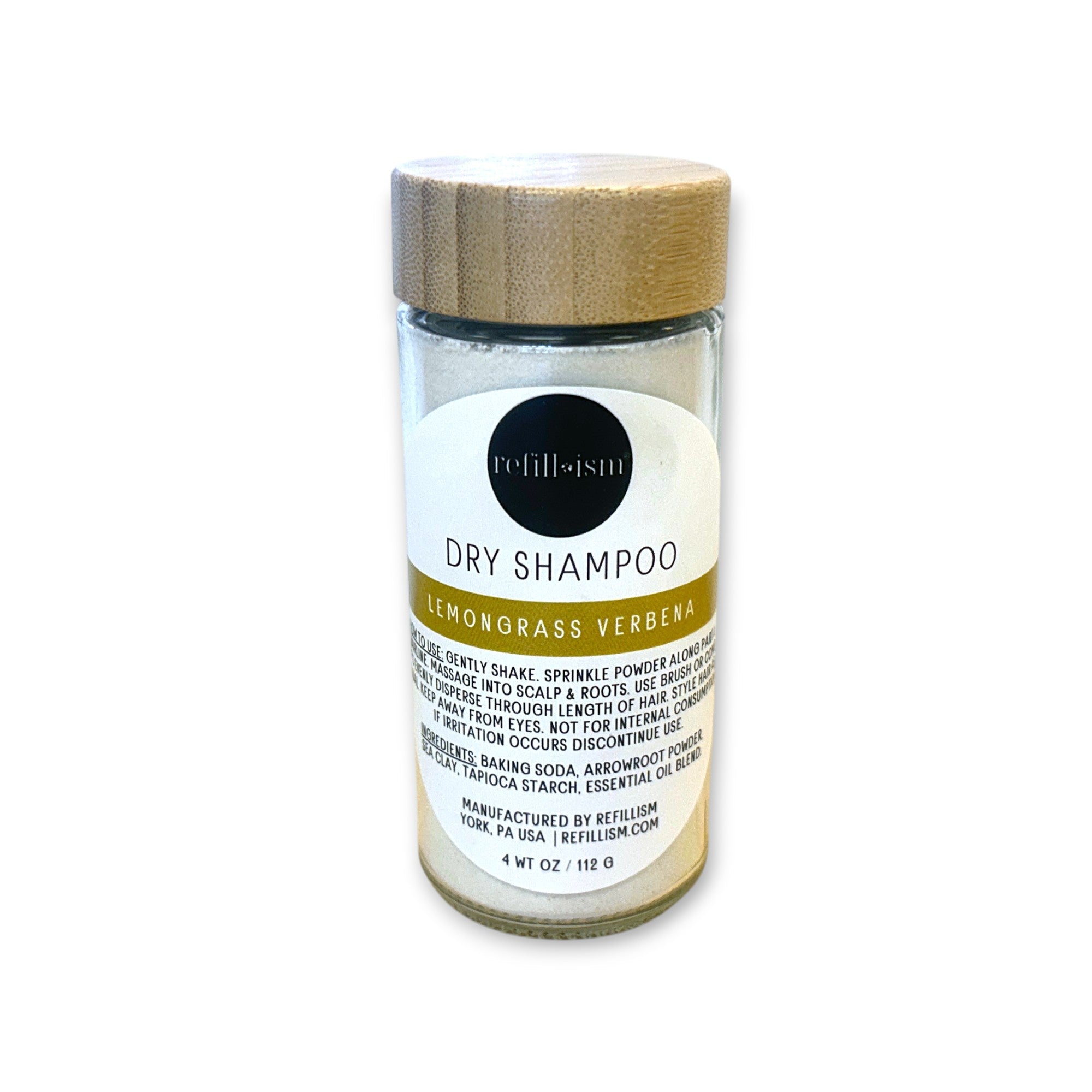 Refillism dry shampoo in lemongrass verbena scent, in a clear glass shaker for personal care and quick hair refreshment.