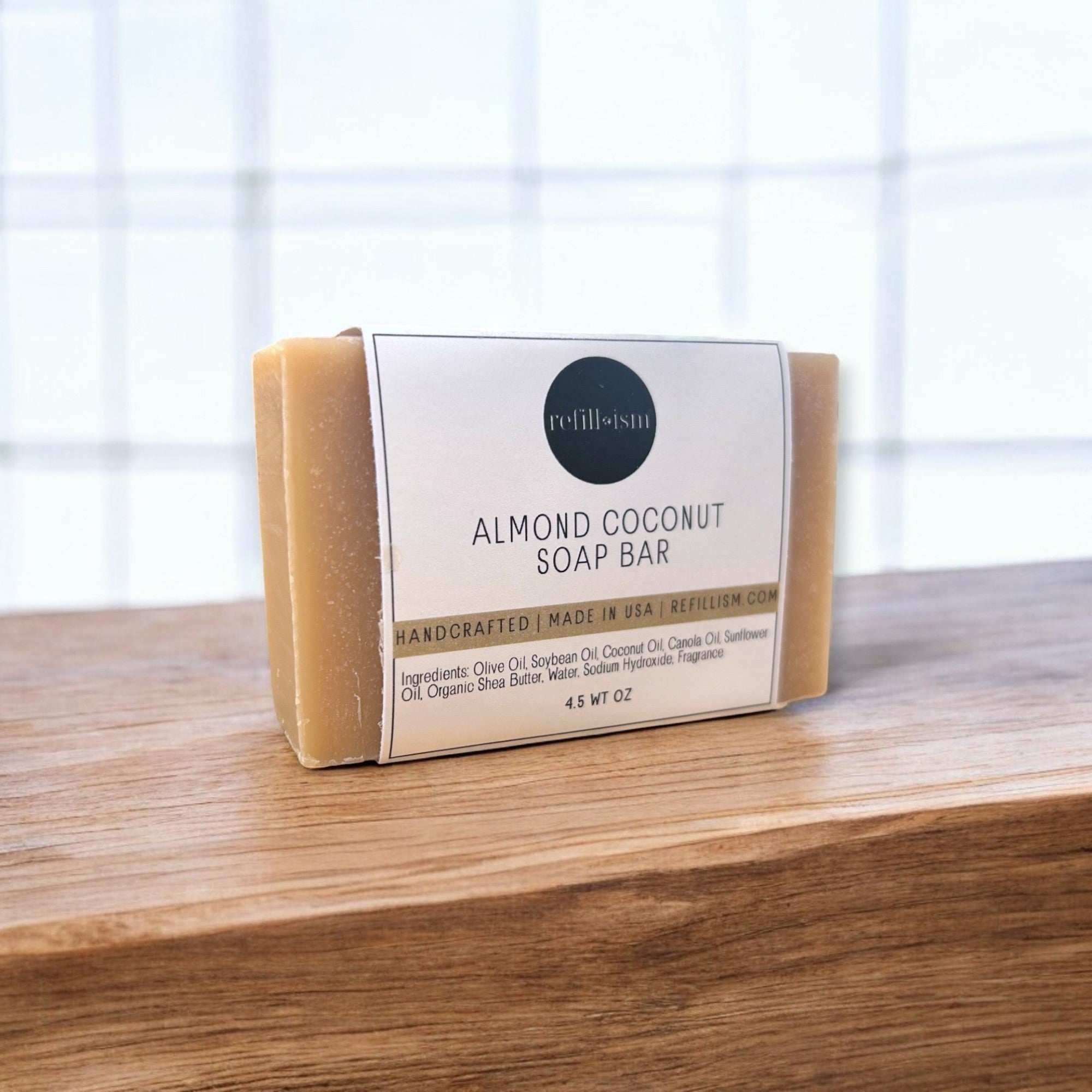 Almond coconut soap bar by Refillism, natural personal care product with a smooth, creamy texture and fresh scent.