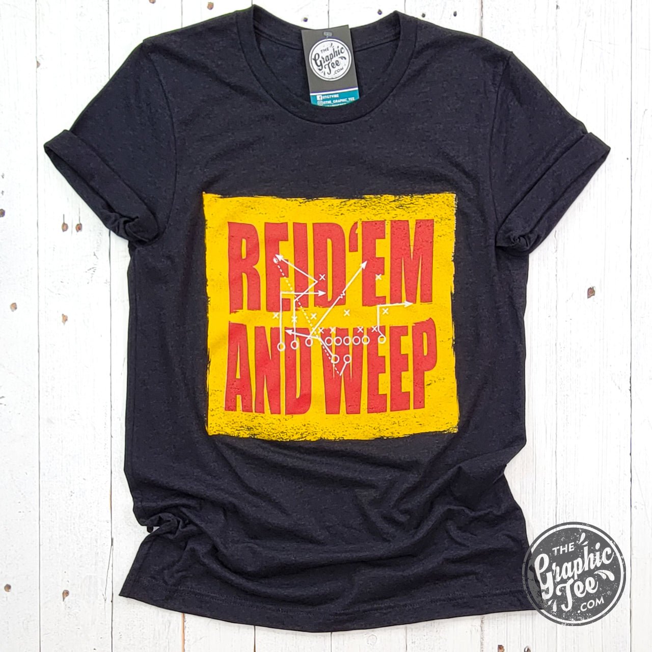 Reid 'Em And Weep black heather short sleeve crew neck graphic tee by The Graphic Tee, showing the front design and fabric texture.