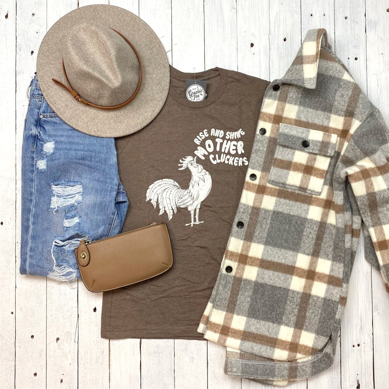 Unisex Rise and Shine Mother Cluckers graphic T-shirt by The Graphic Tee, showing a fun chicken design on a white cotton tee.