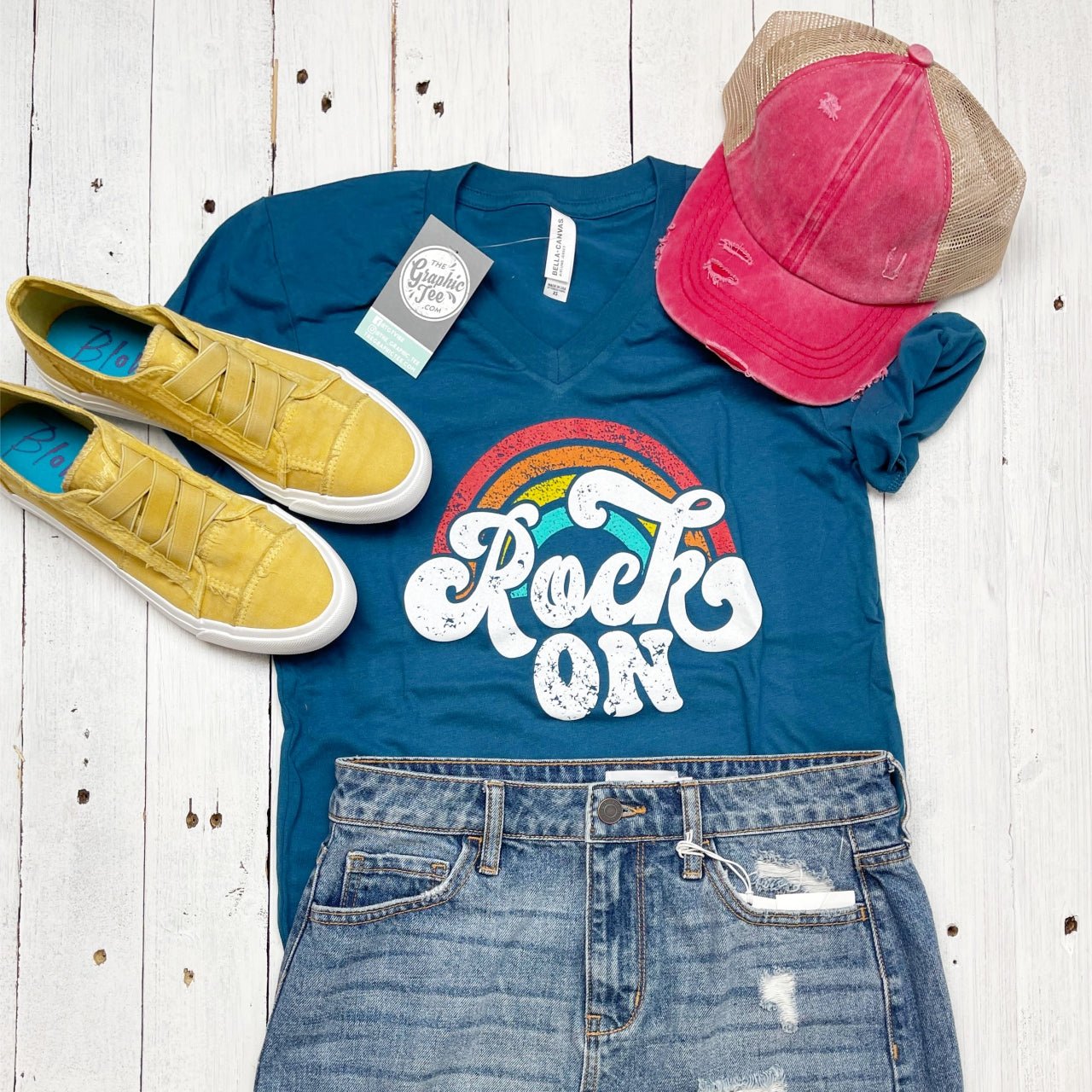 Deep teal short sleeve V-neck graphic tee by The Graphic Tee featuring a rock-on design on the front.