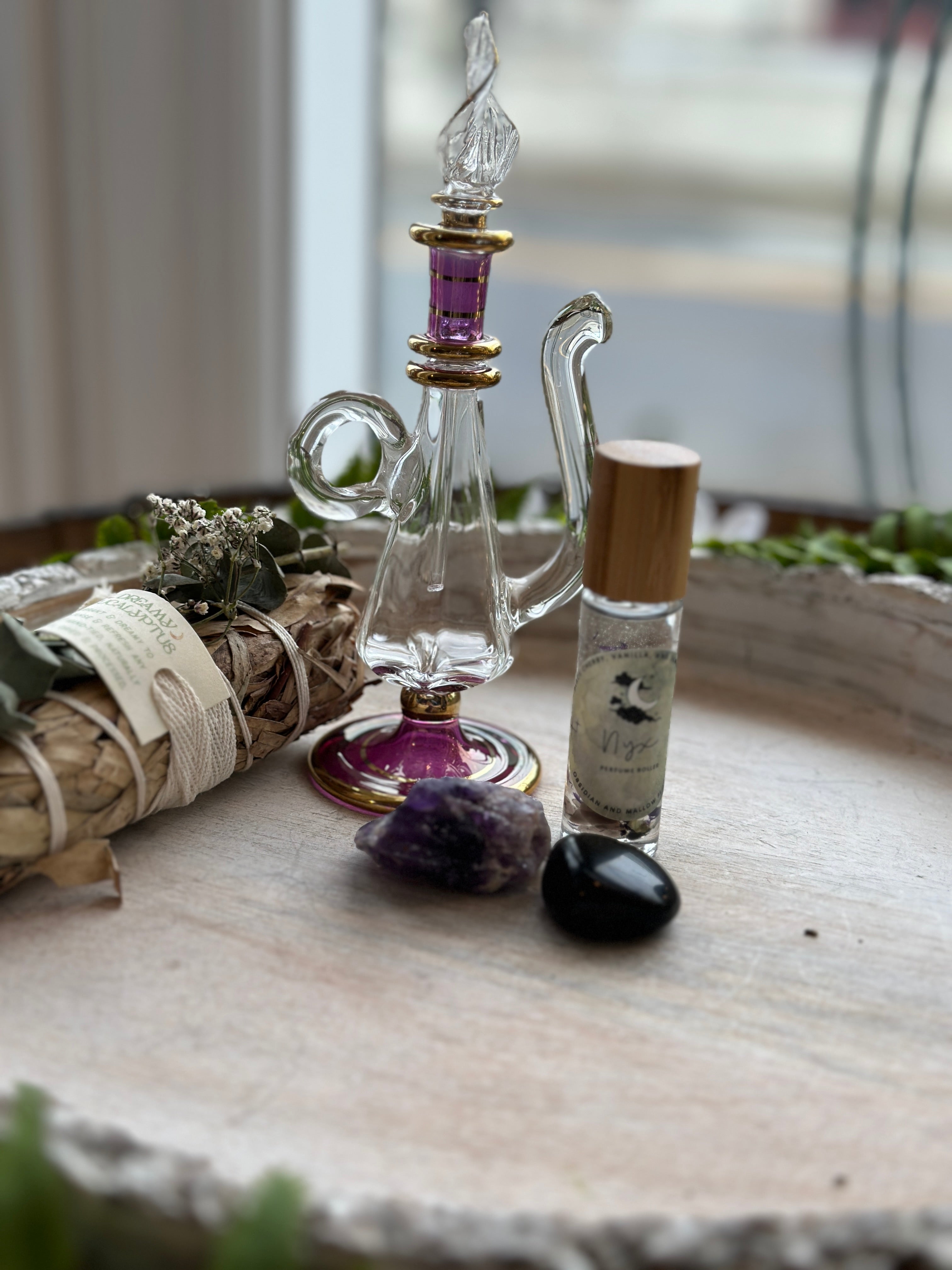 Sage & Stone Apothecary Goddess Perfume Roller with floral and herbal scents, displayed in a clear glass roller bottle.