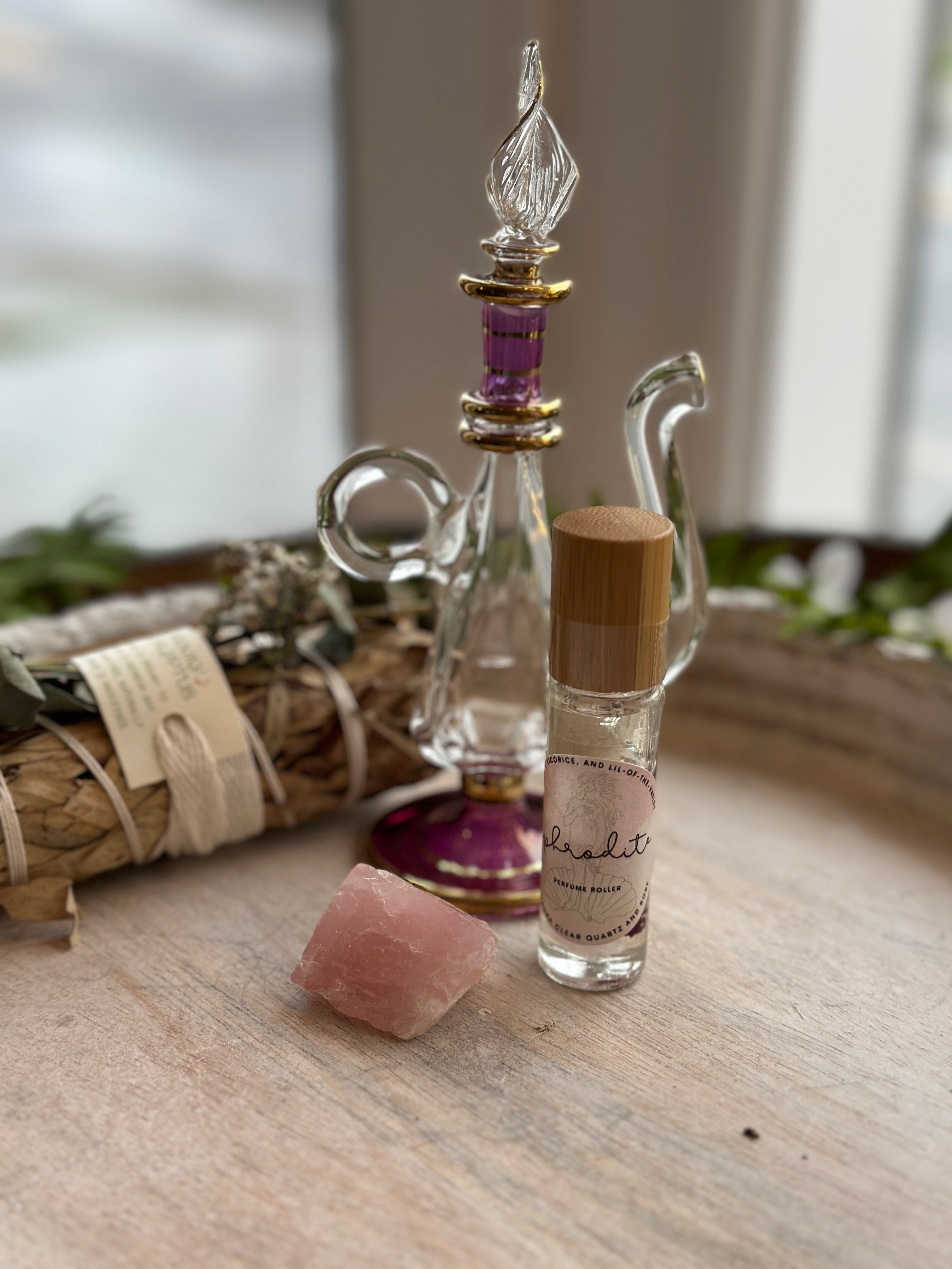 Sage & Stone Apothecary Goddess Perfume Roller for body care, featuring a sleek glass roller bottle with herbal fragrance.