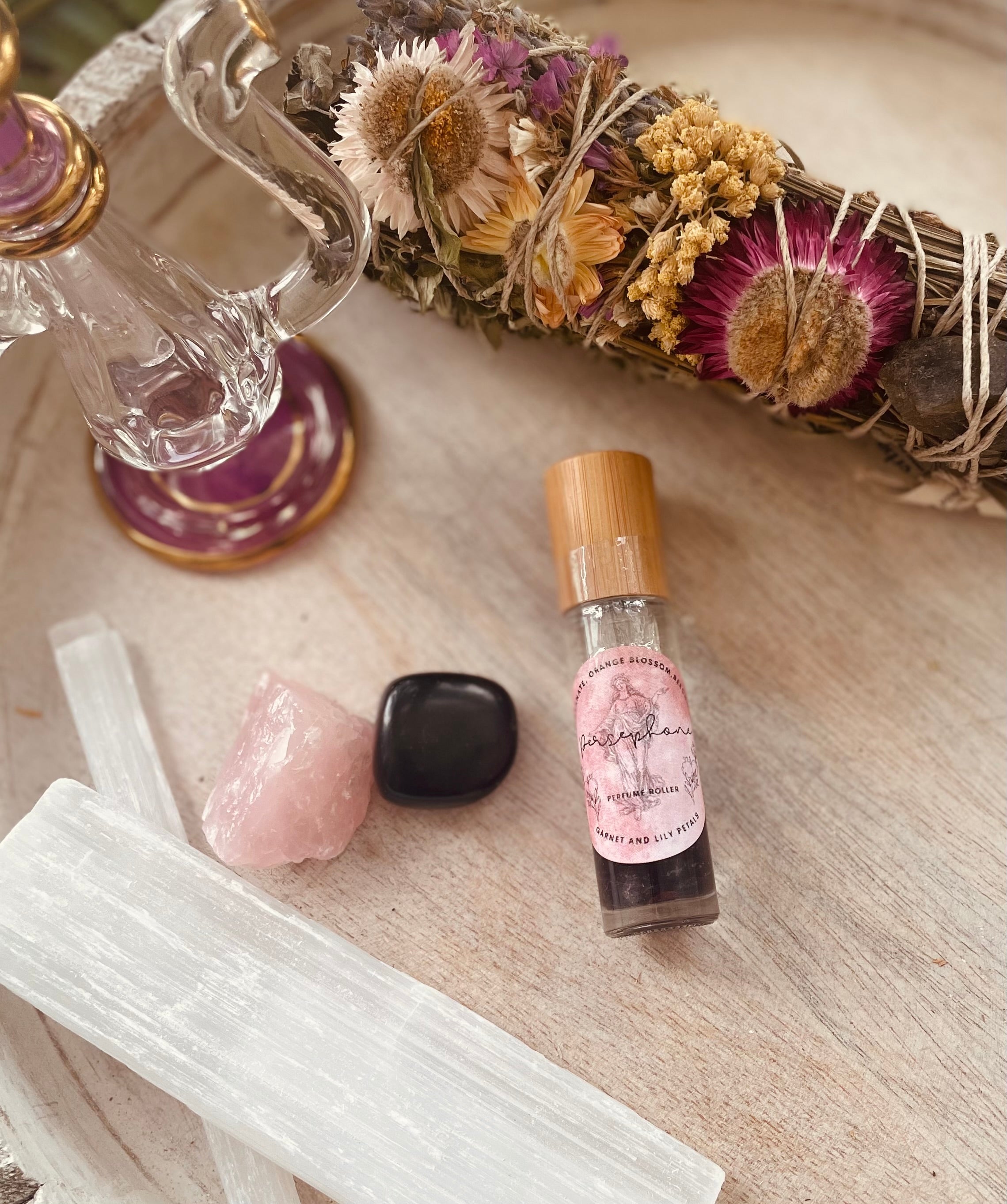 Sage & Stone Apothecary Goddess Perfume Roller, a body care product with a sleek rollerball design and elegant packaging.
