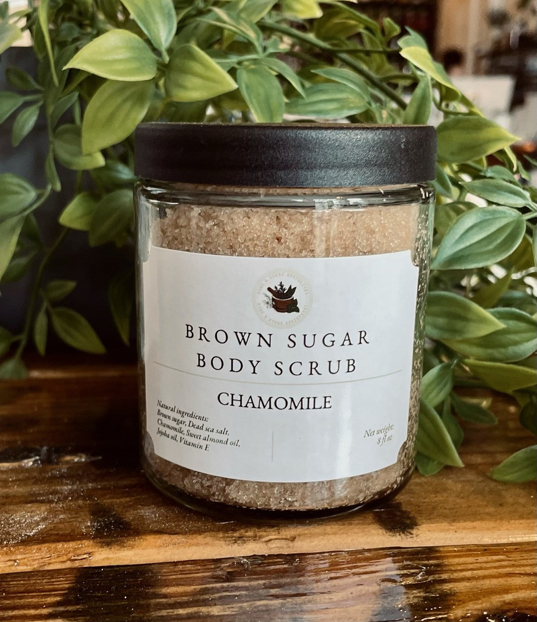 Brown Sugar Chamomile Scrub by Sage & Stone Apothecary, showing a jar of exfoliating personal care product with natural ingredients.