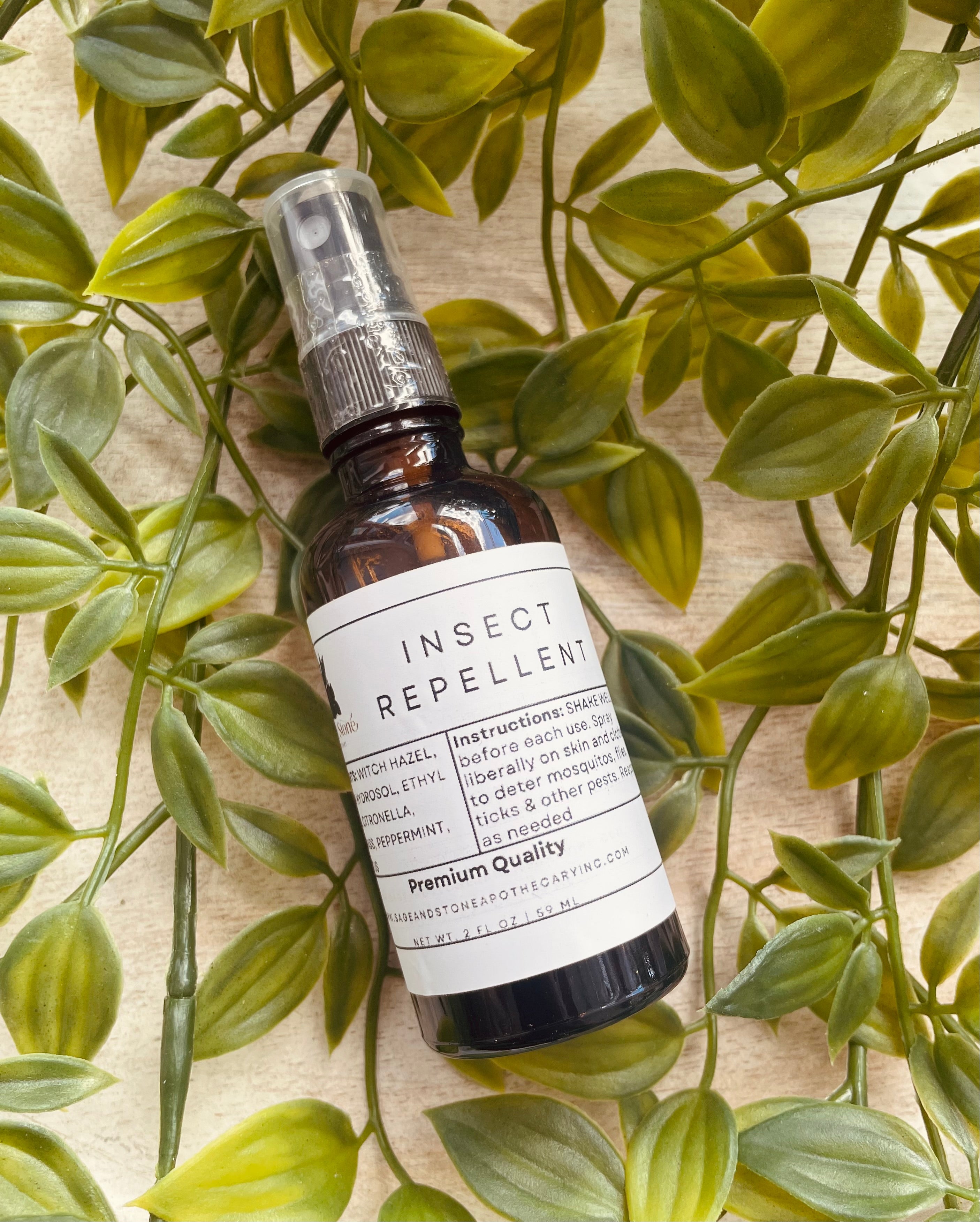 Sage & Stone Apothecary insect repellent spray shown in a clear bottle with a natural label, designed for personal care and wellness.