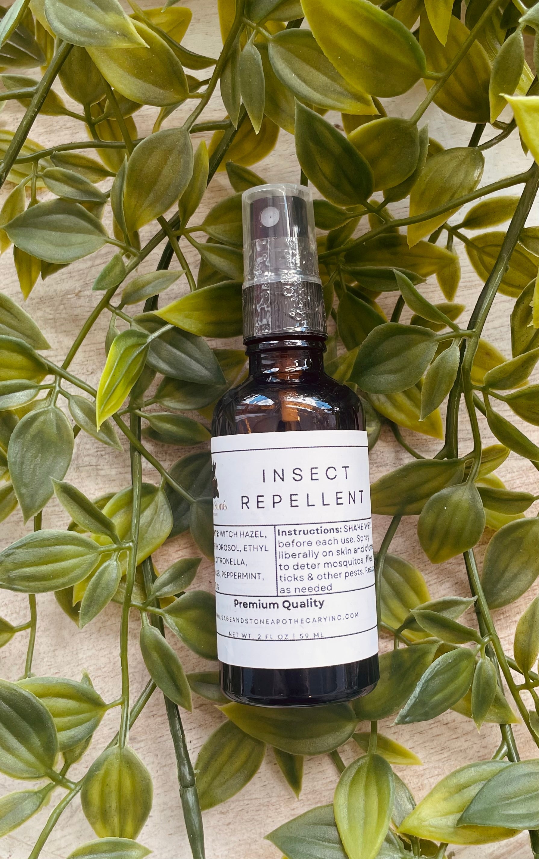 Sage & Stone Apothecary insect repellent spray for personal care, featuring natural ingredients in a clear bottle with a pump dispenser.