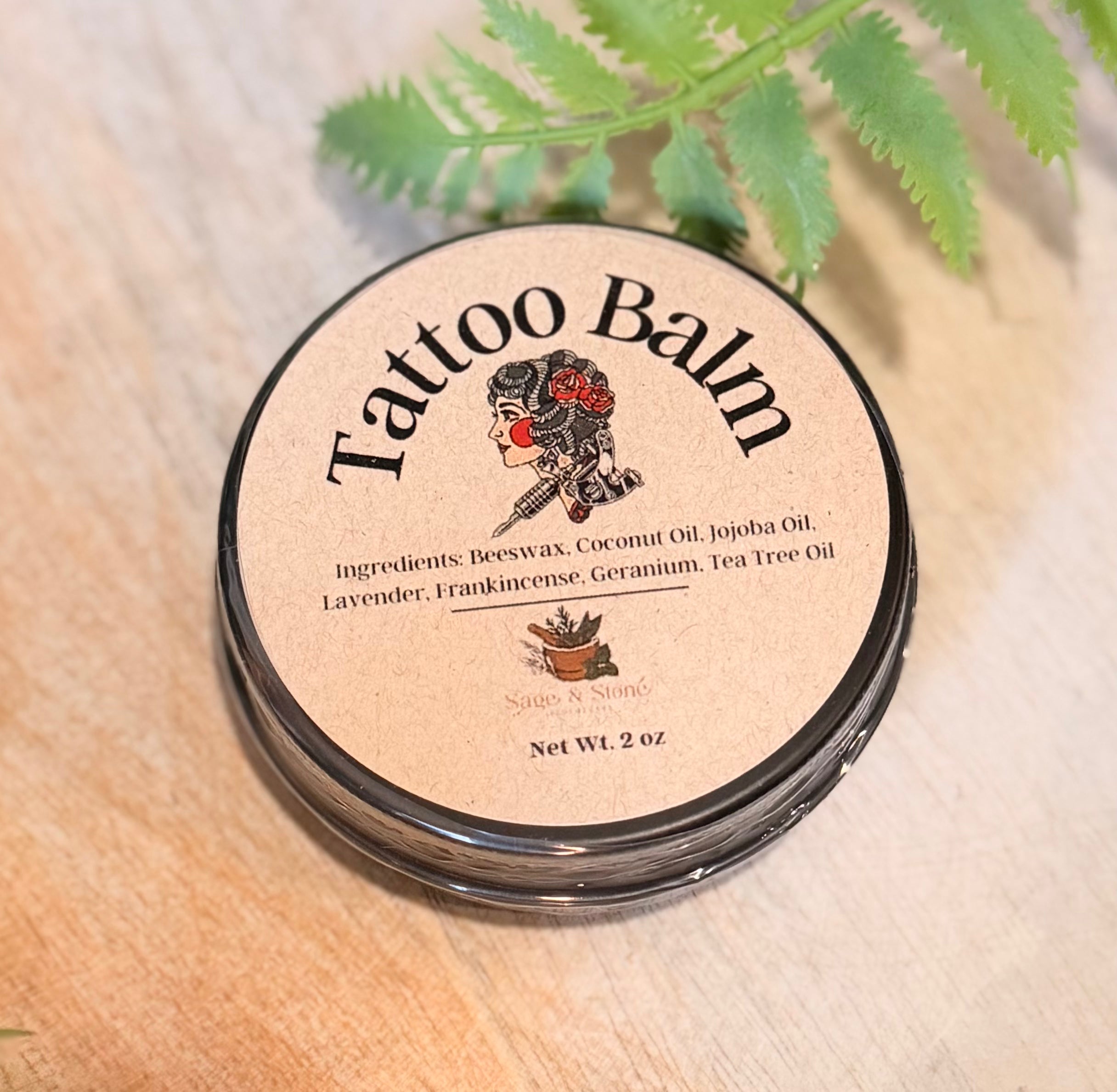 Sage & Stone Apothecary tattoo healing balm jar with natural ingredients, designed to soothe and care for fresh tattoos.