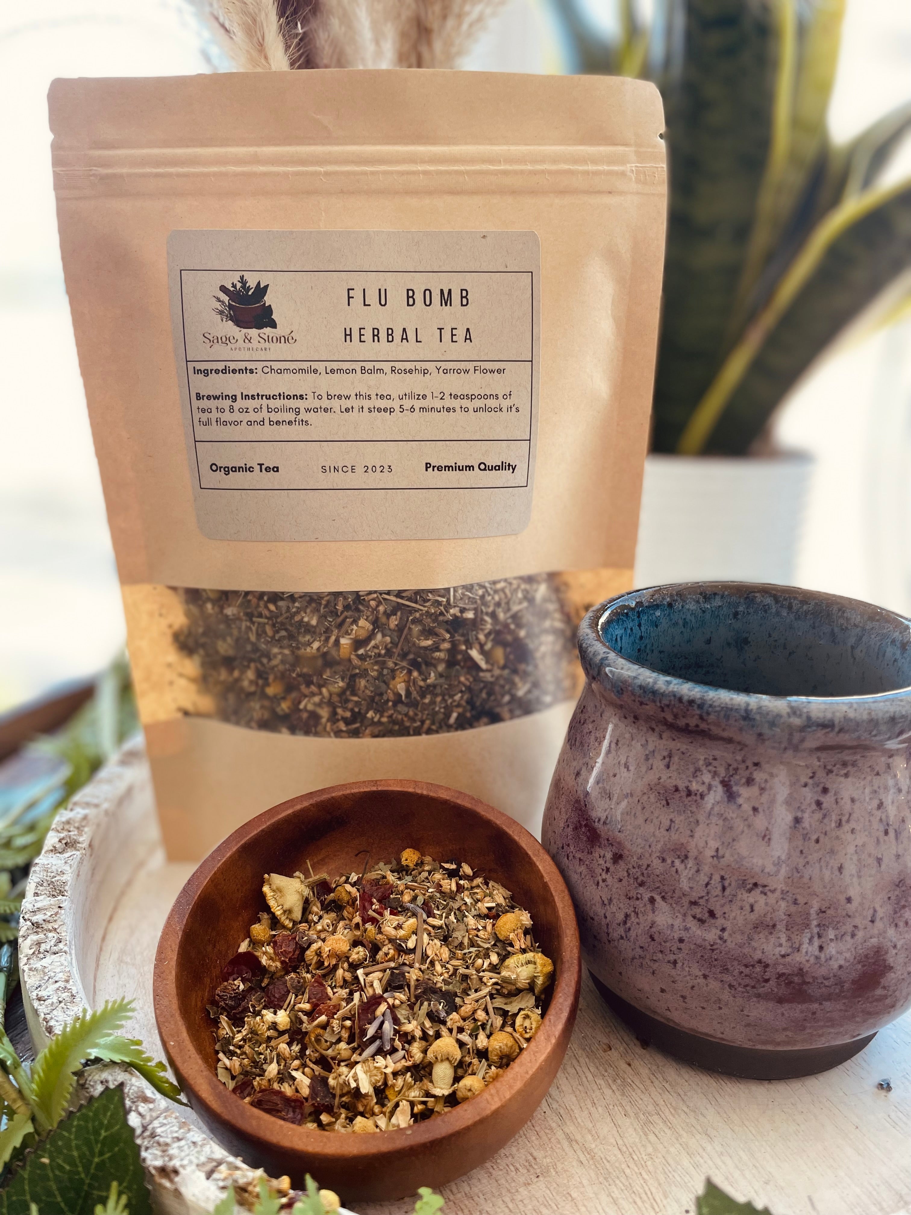 Sage & Stone Cold Defender herbal tea in a glass cup, featuring dried herbs and vibrant tea leaves, designed to support immune health.