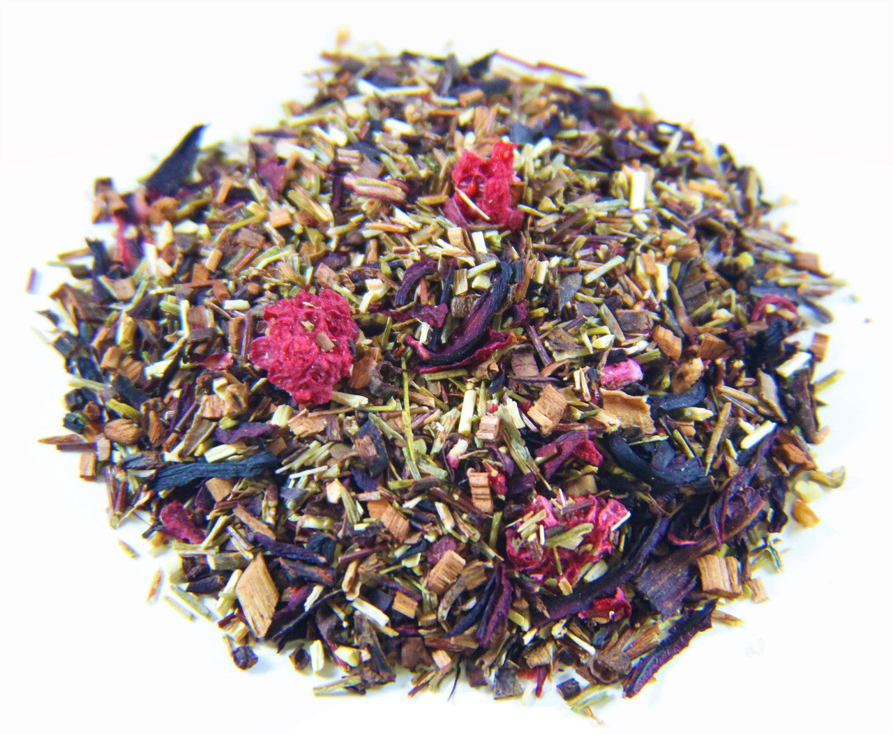 Cup of Raspberry Hibiscus tea by Sage & Stone Apothecary with fresh raspberries and hibiscus flowers on a wooden table.
