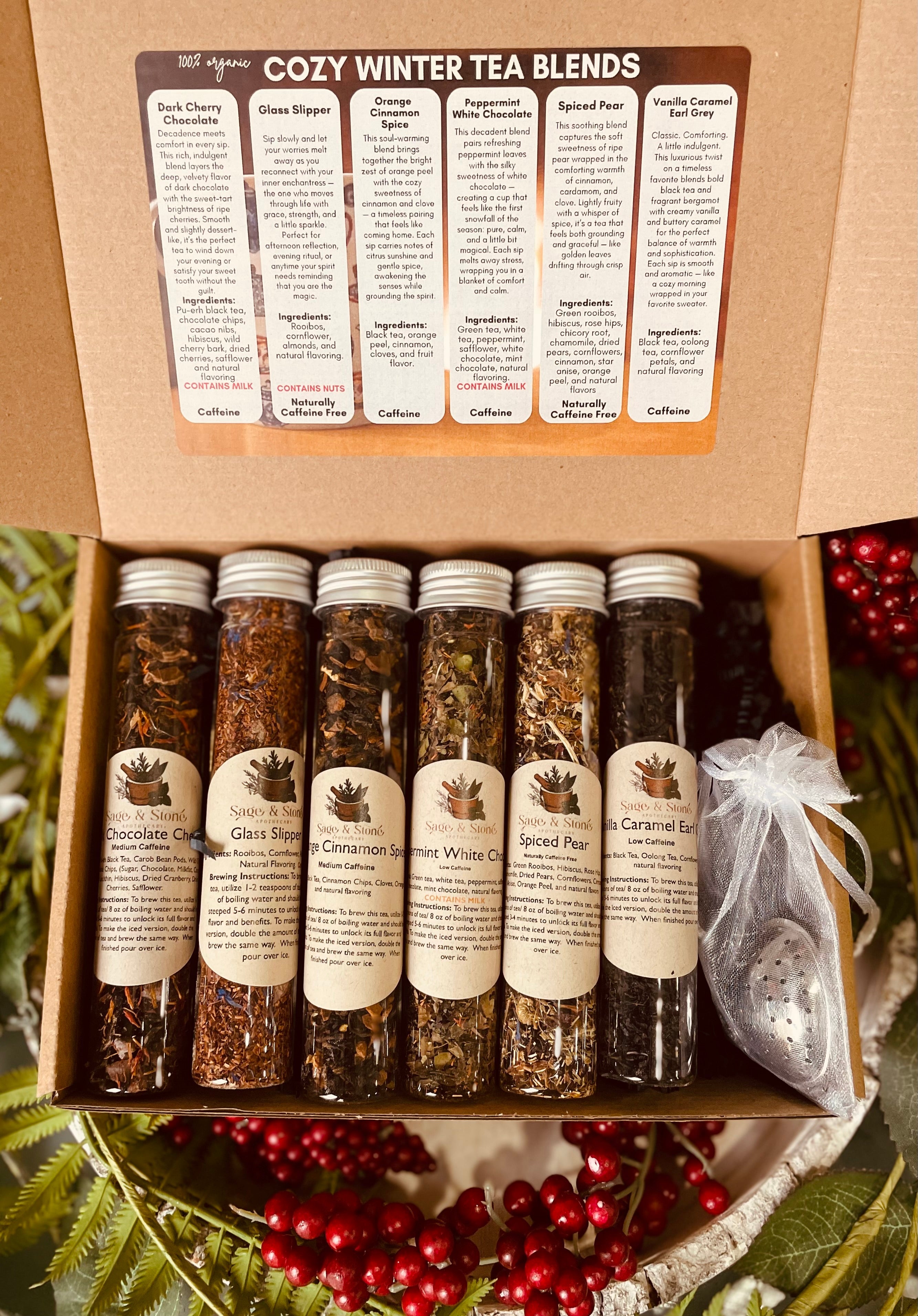 Assorted cozy winter tea sampler by Sage & Stone Apothecary with various tea bags in festive packaging.