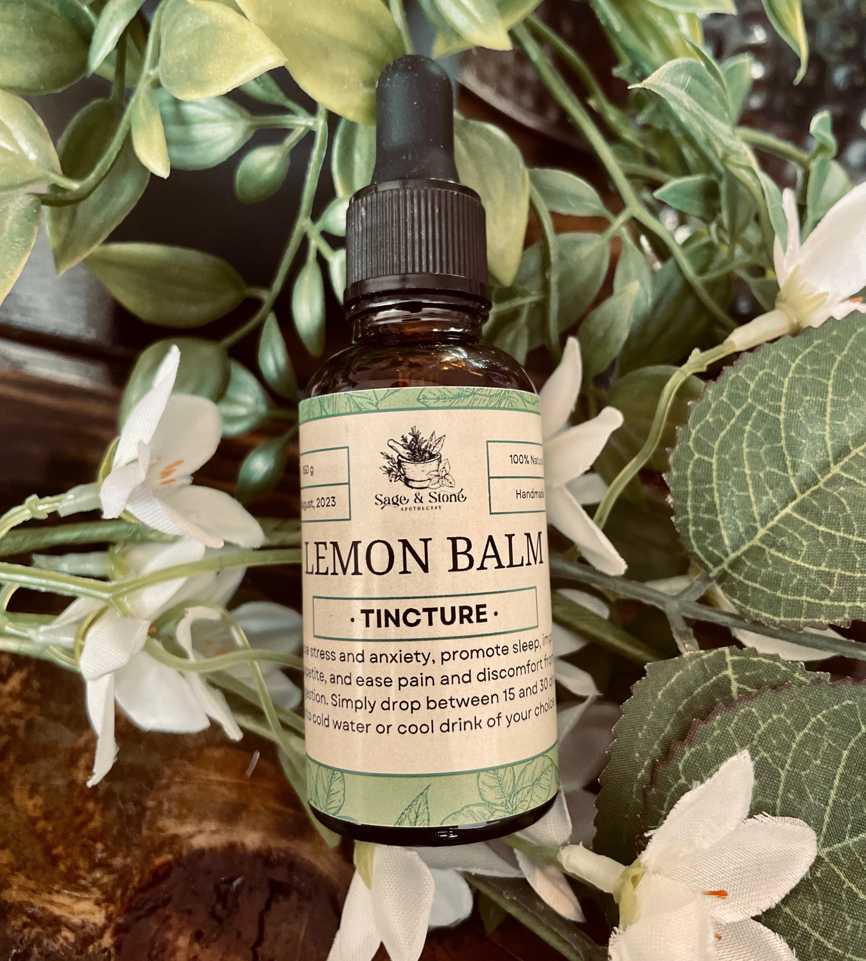 Lemon balm tincture in a glass bottle with dropper from Sage & Stone Apothecary, labeled for herbal remedy use.