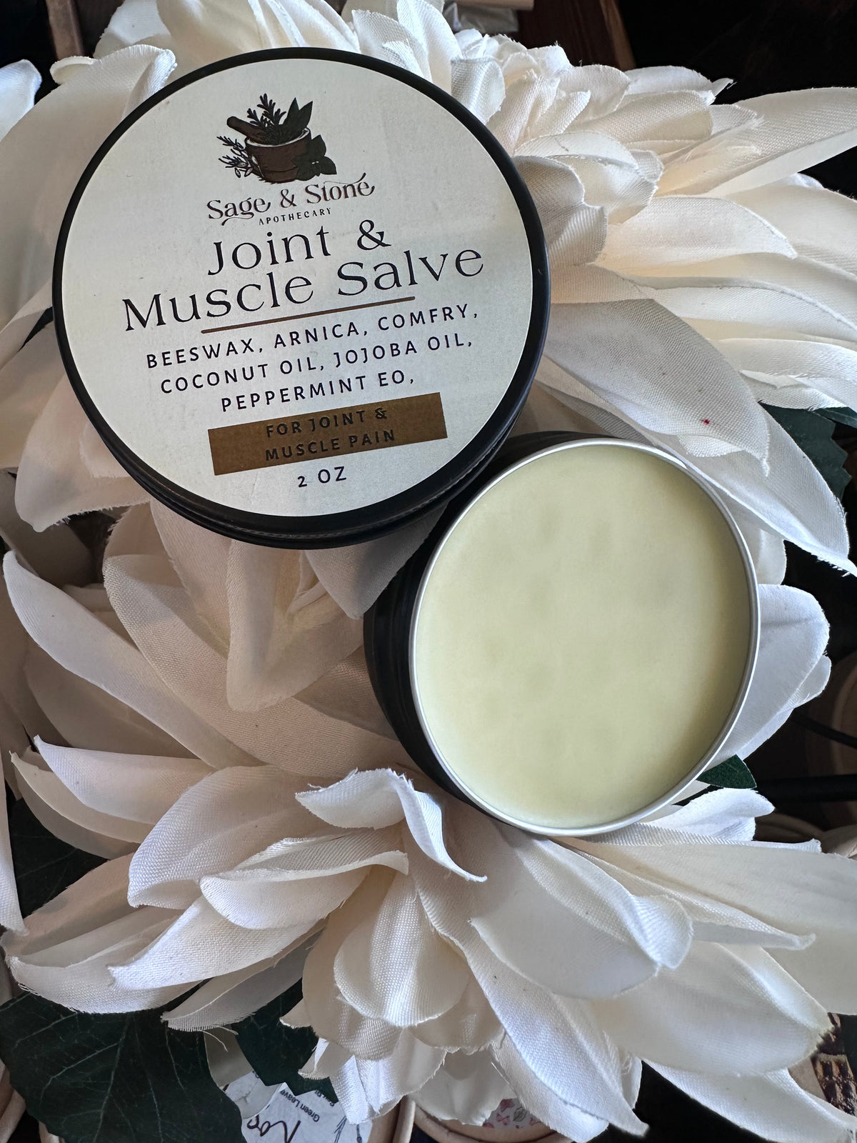 Sage & Stone Apothecary joint and muscle salve jar with herbal ingredients, designed for wellness and soothing muscle relief.