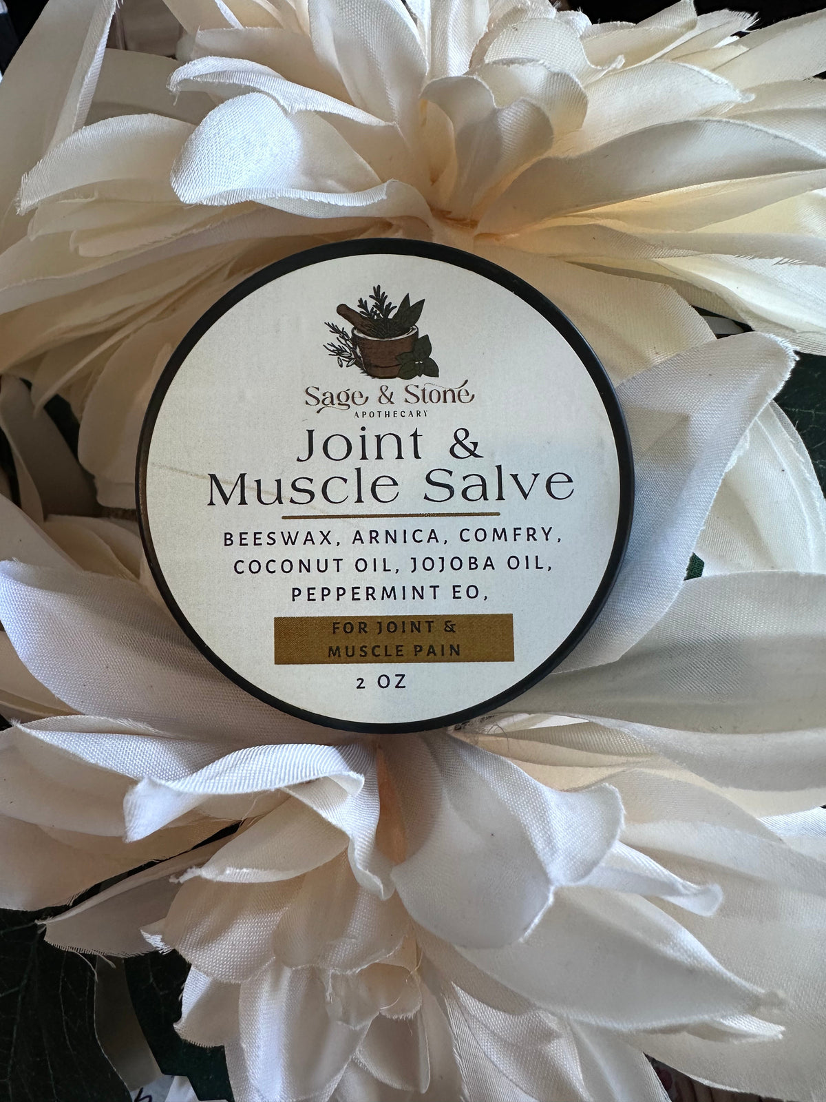 Sage & Stone Apothecary Joint & Muscle Salve in a jar, natural wellness product for soothing sore muscles and joint discomfort.