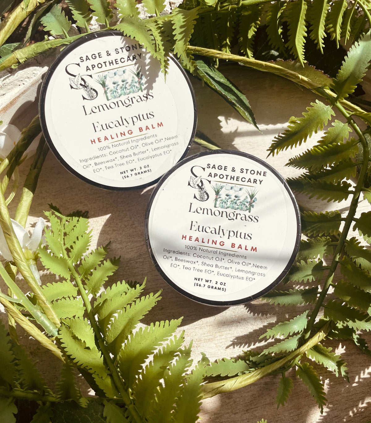Lemongrass and eucalyptus healing balm jar from Sage & Stone Apothecary, with herbal ingredients and natural wellness packaging.