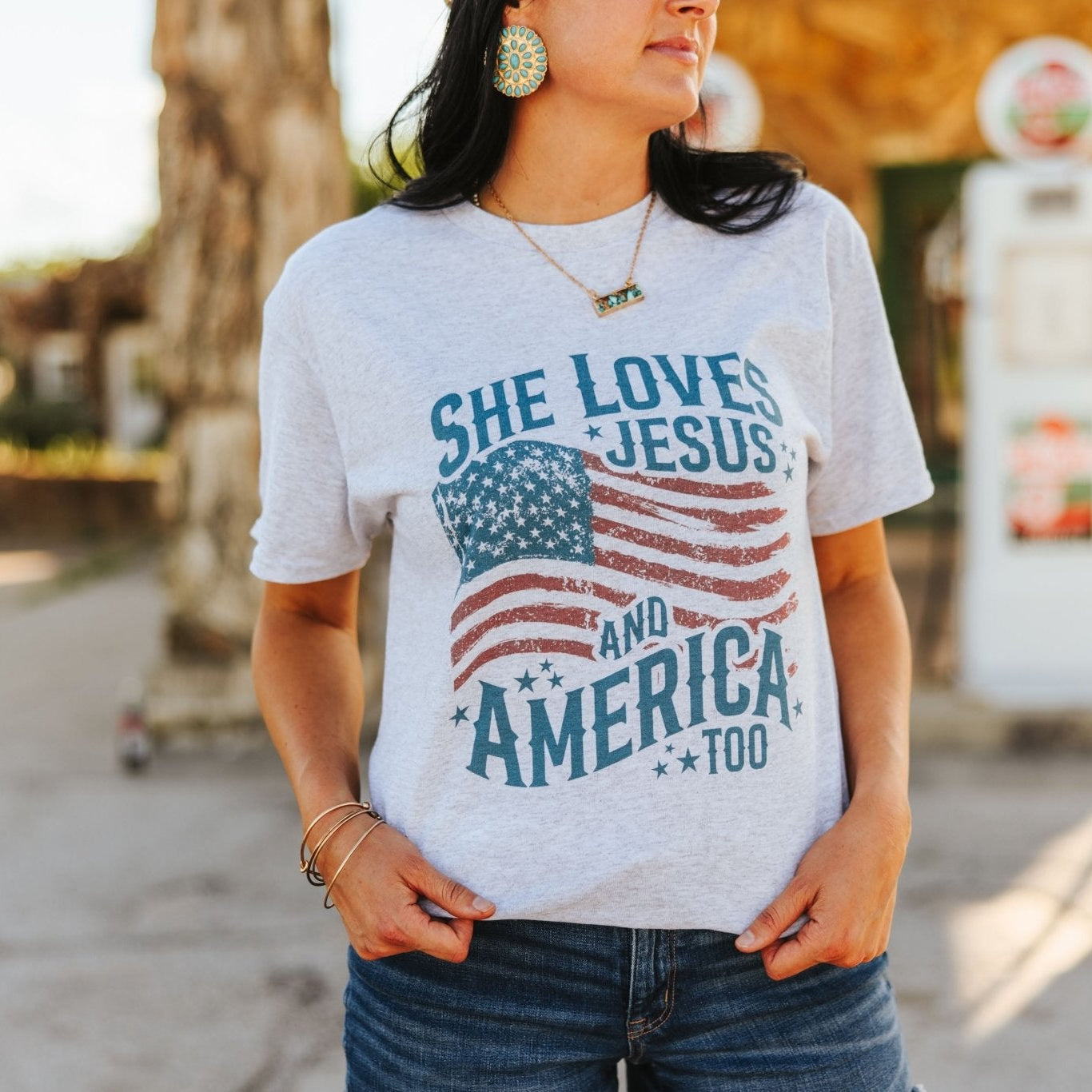 Wild Junkie She Loves Jesus & America graphic tee featuring patriotic and faith-based design on a casual cotton shirt.