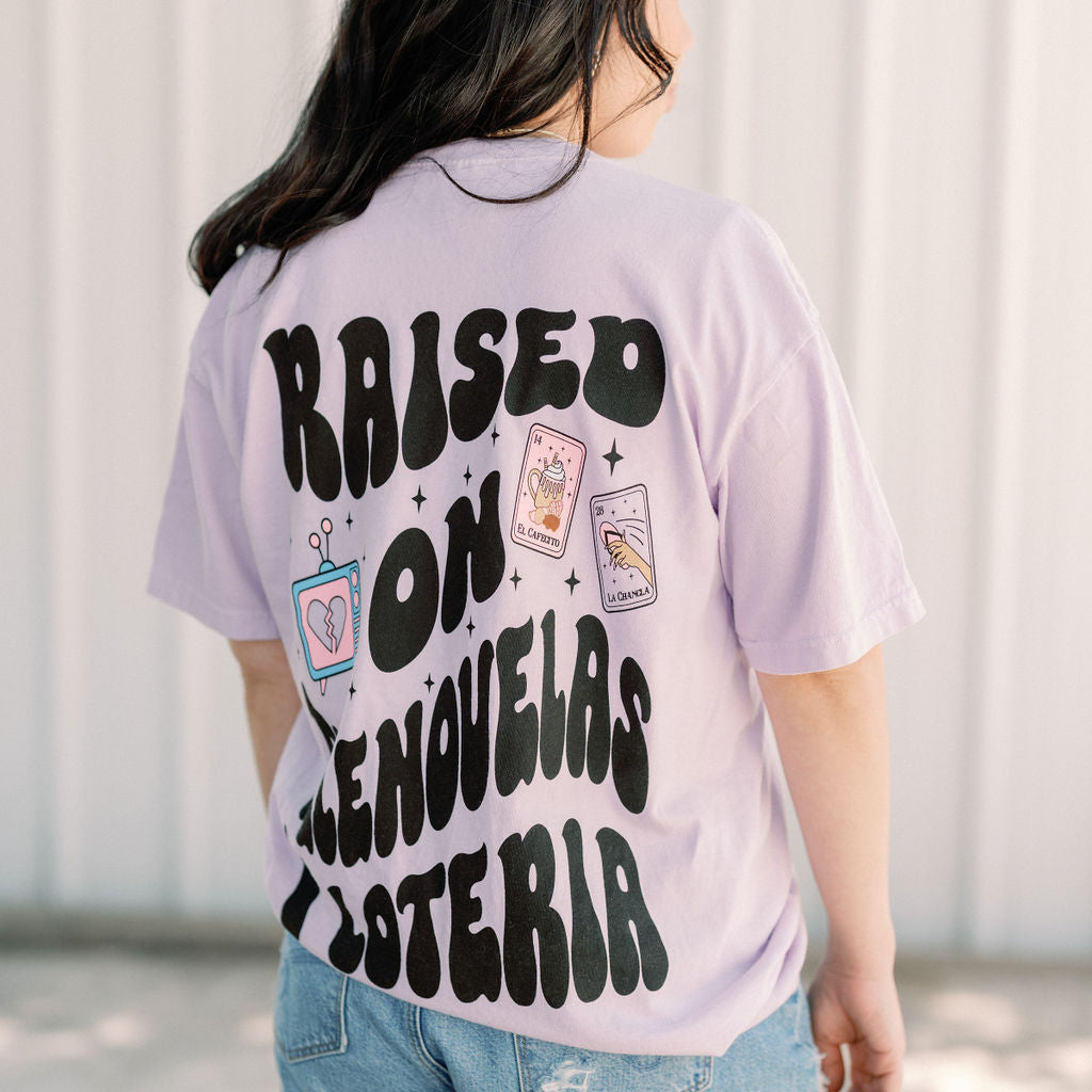 Loteria graphic T-shirt by Shop Karma Tees featuring colorful Loteria card designs on a casual cotton tee.