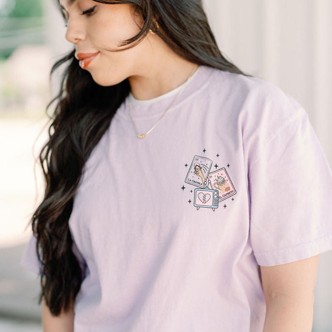 Loteria graphic T-shirt by Shop Karma Tees featuring colorful traditional Mexican Loteria card illustrations on a black tee.