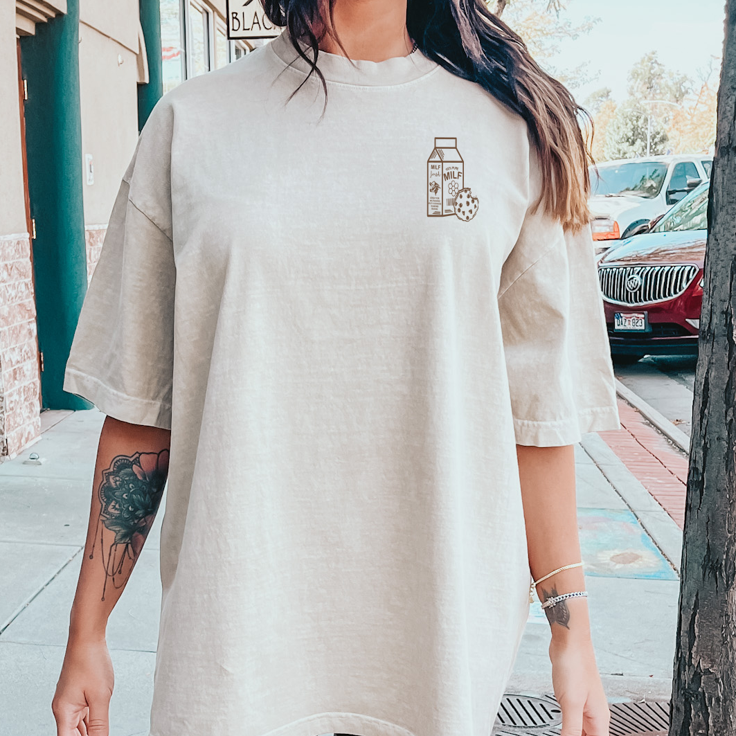 Front view of a graphic T-shirt featuring the "Milf and Cookies" design by Shop Karma Tees