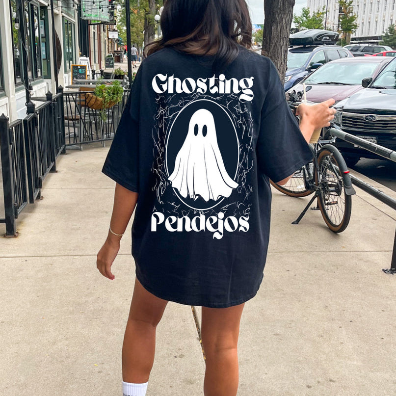 Men's Ghosting Pendejos graphic T-shirt by Shop Karma Tees featuring bold printed design on black fabric.