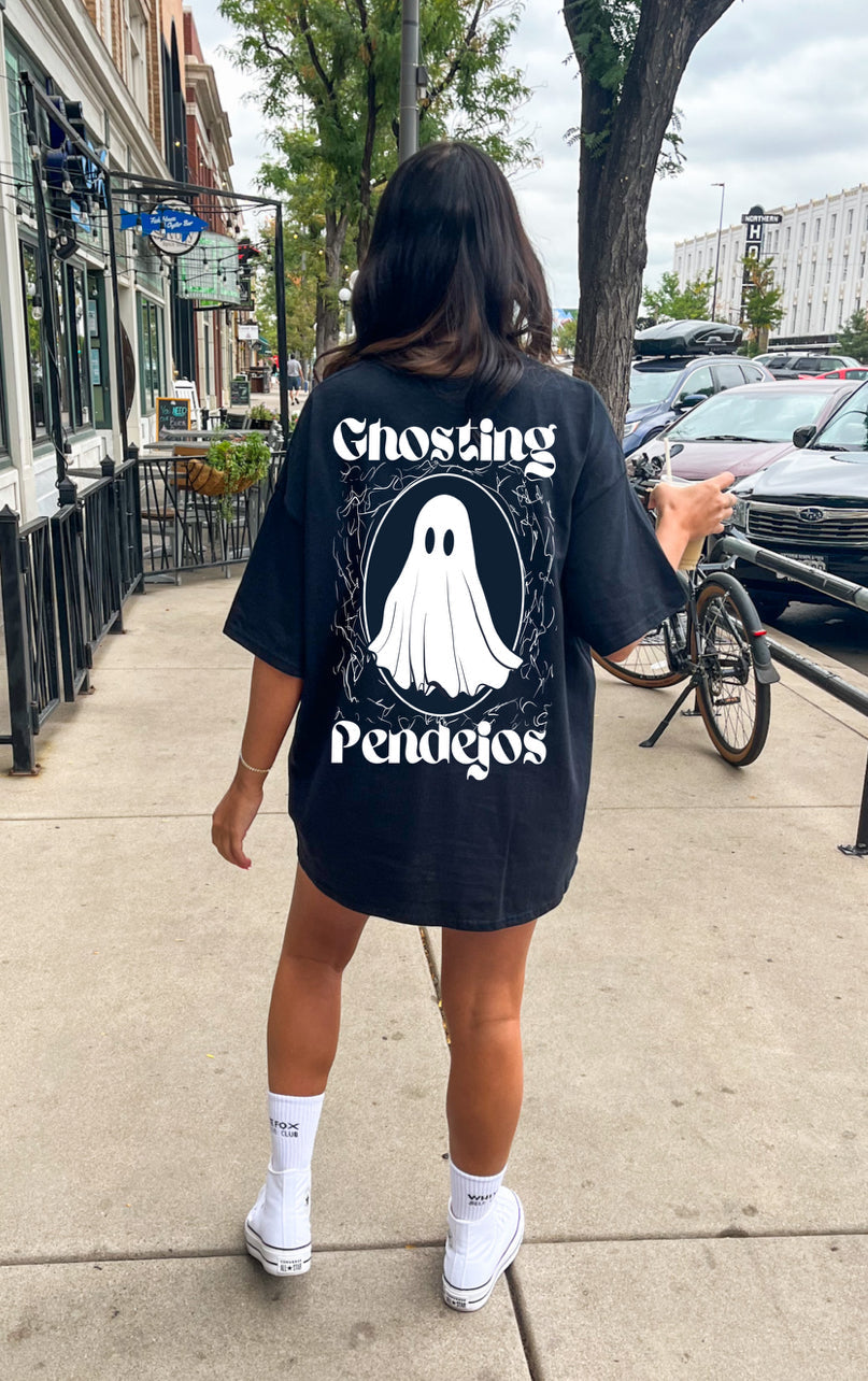 Men's Ghosting Pendejos graphic T-shirt by Shop Karma Tees featuring bold printed design on black fabric.